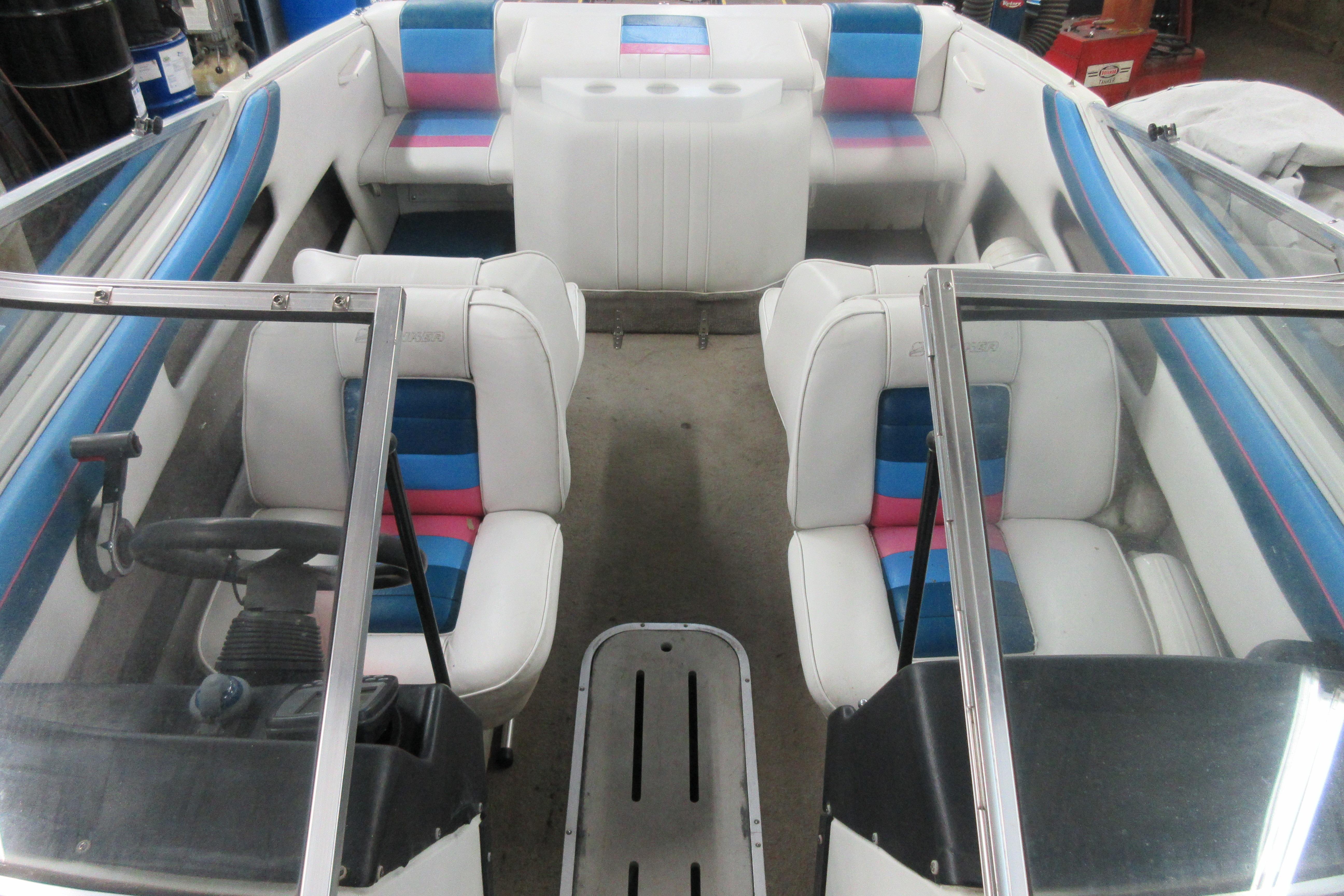 1993 Rinker 186 Captiva Bowrider interior with colorful seating and steering wheel.