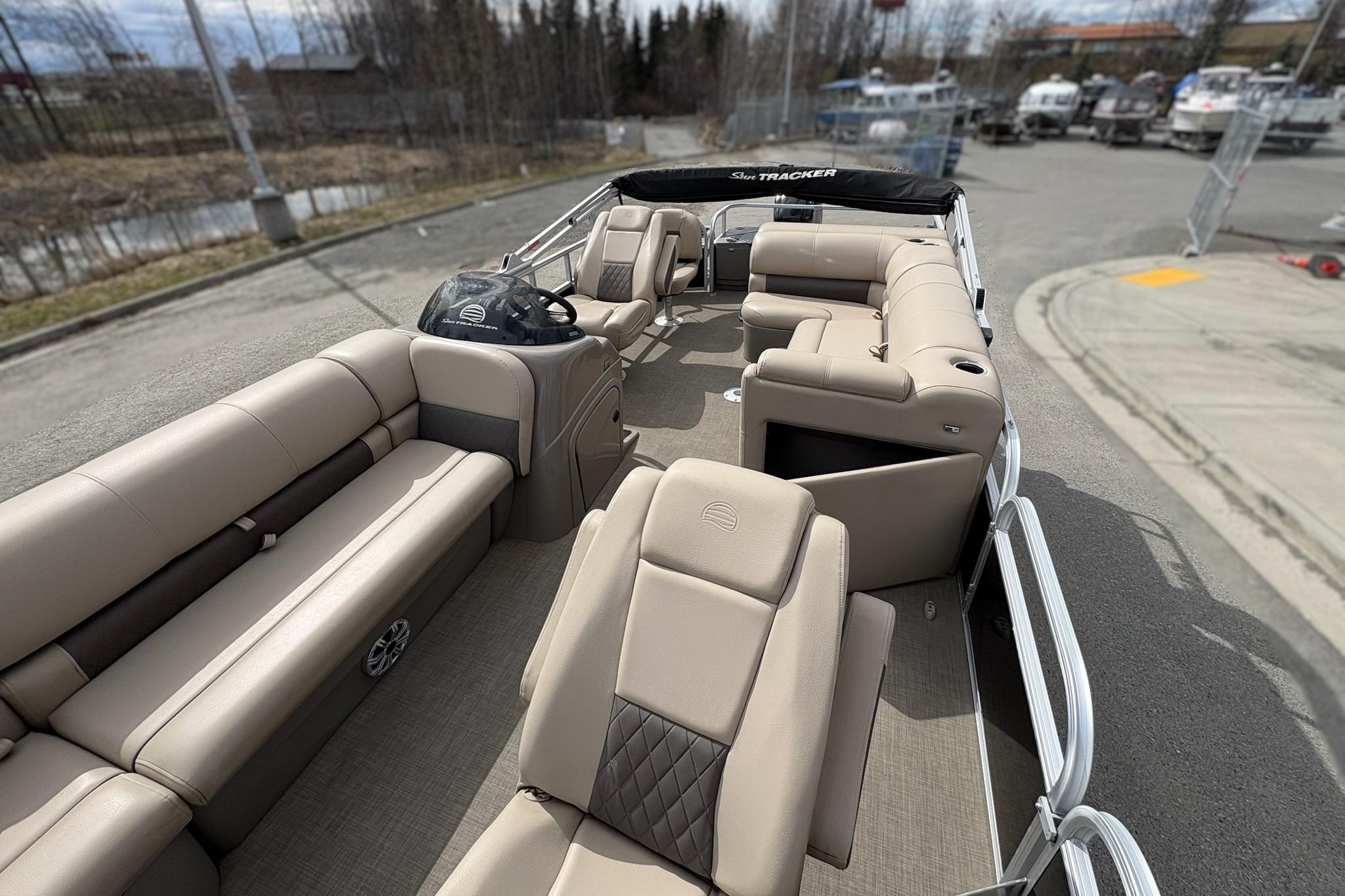 2023 Sun Tracker SportFish 20 DLX pontoon boat with spacious seating and modern design.