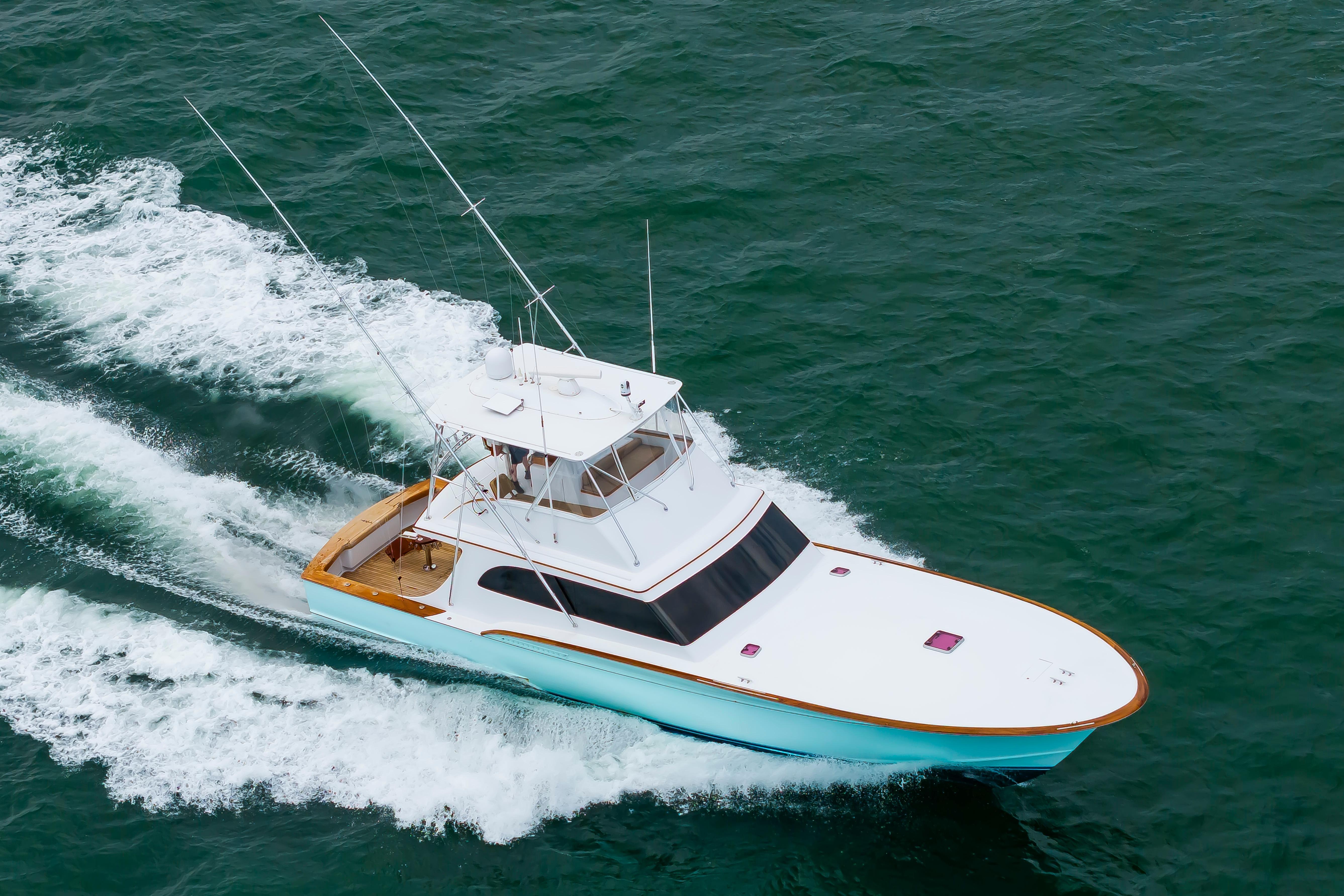 Custom Carolina Scarborough 56 Convertible yacht cruising on open water, 1993 model.
