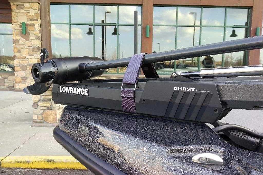 Lowrance Ghost trolling motor on 2024 Nitro ZV21 Pro boat, parked outside a building.