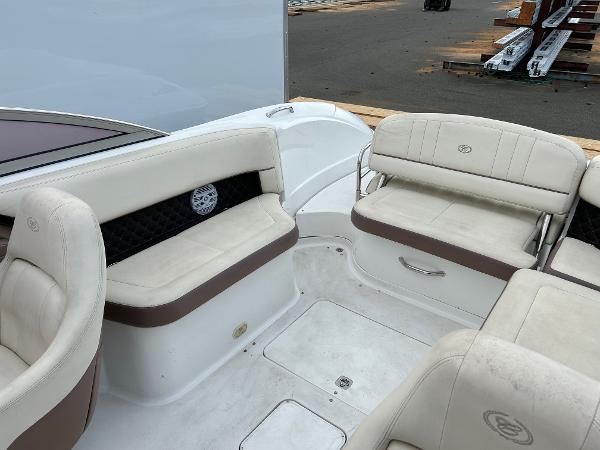 2010 Cobalt 262 boat interior with beige seating and storage compartments.