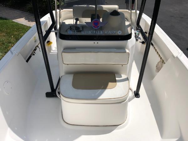 2003 Wellcraft 180 Fisherman boat interior with seating and console.