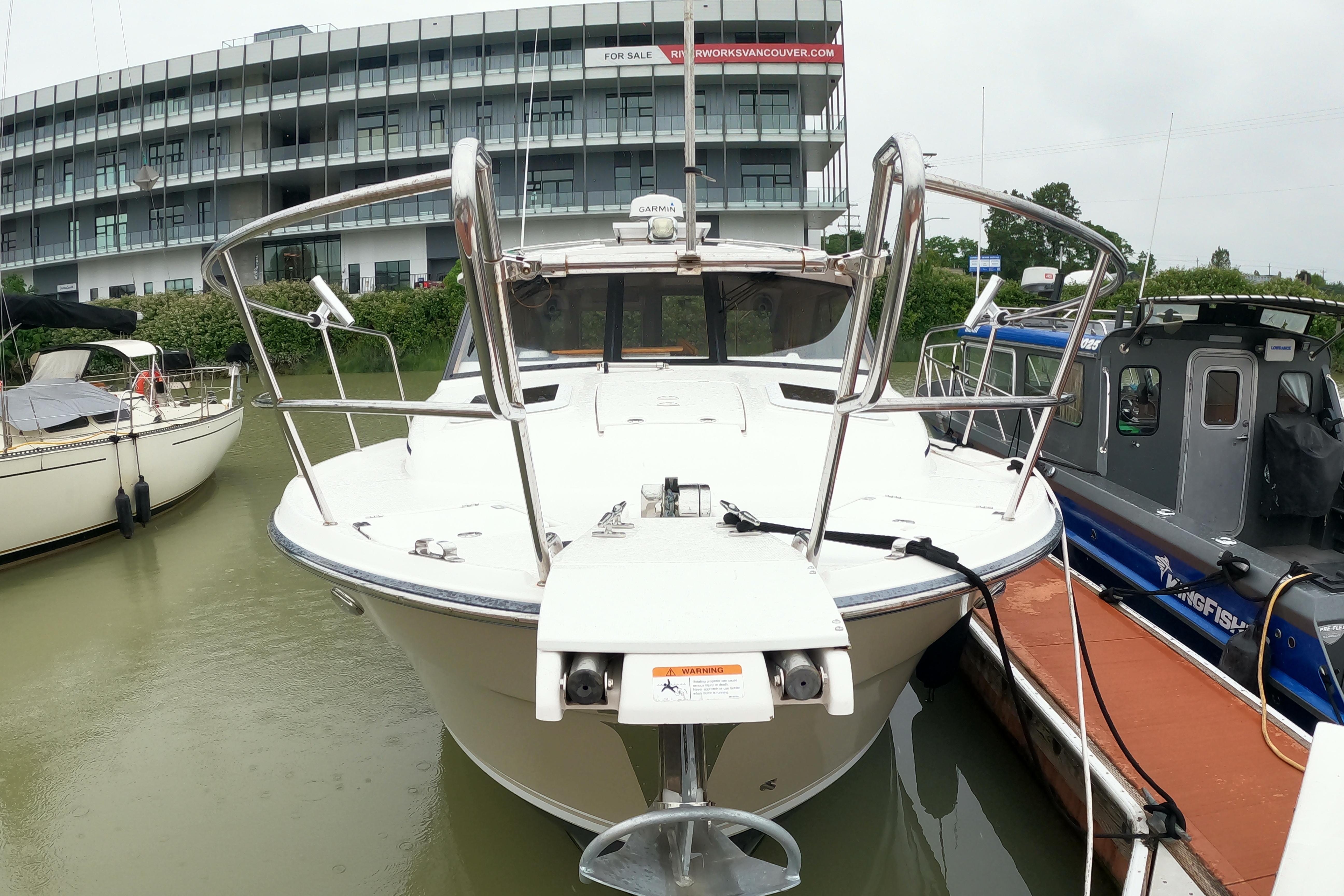 2019 Cutwater C-30 Sedan docked at marina, front view with modern design.