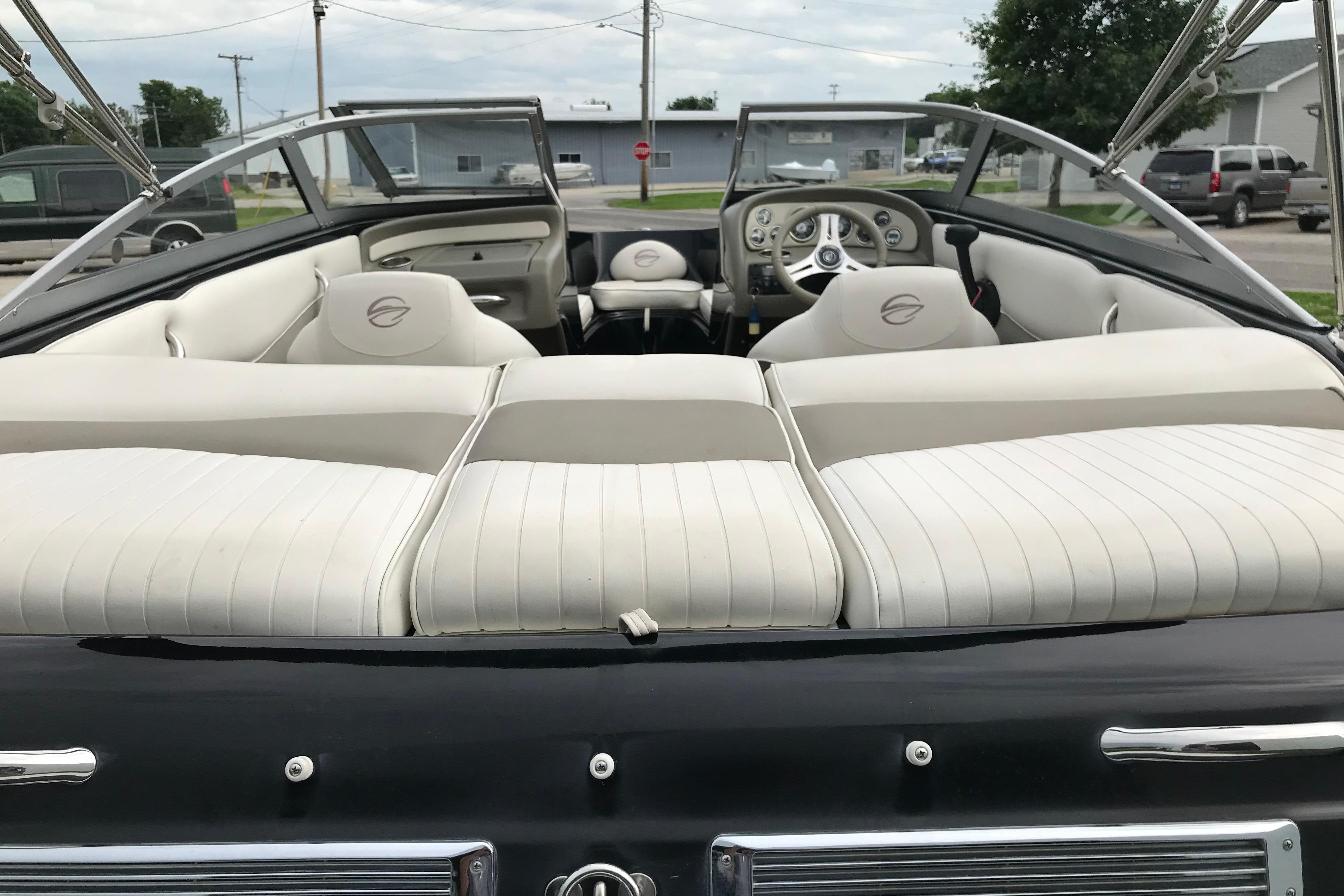 2015 Crownline 18 SS boat interior with white seating and sleek dashboard design.