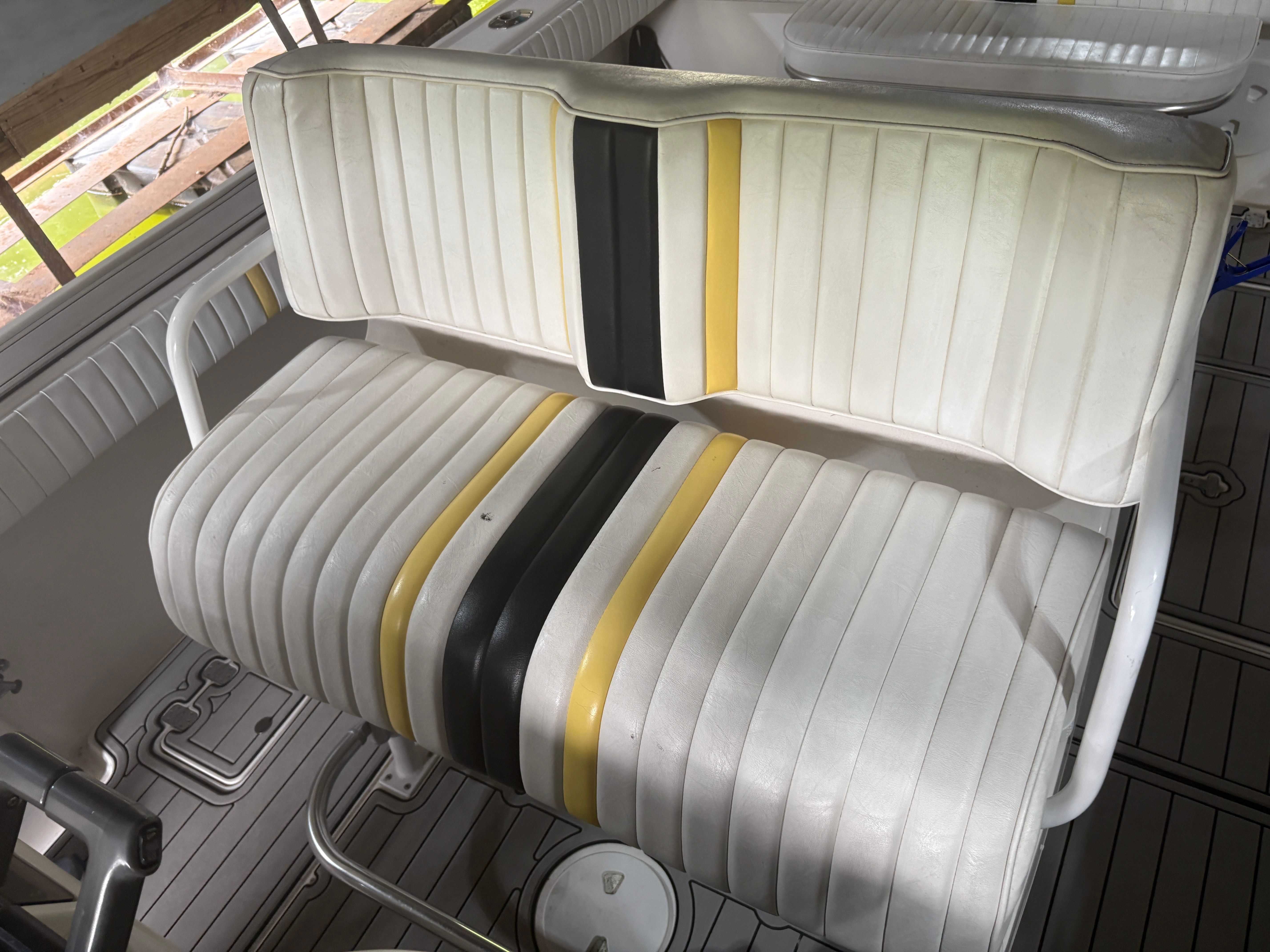 Intrepid 322 Cuddy seat with yellow and black stripes, 2002 model.