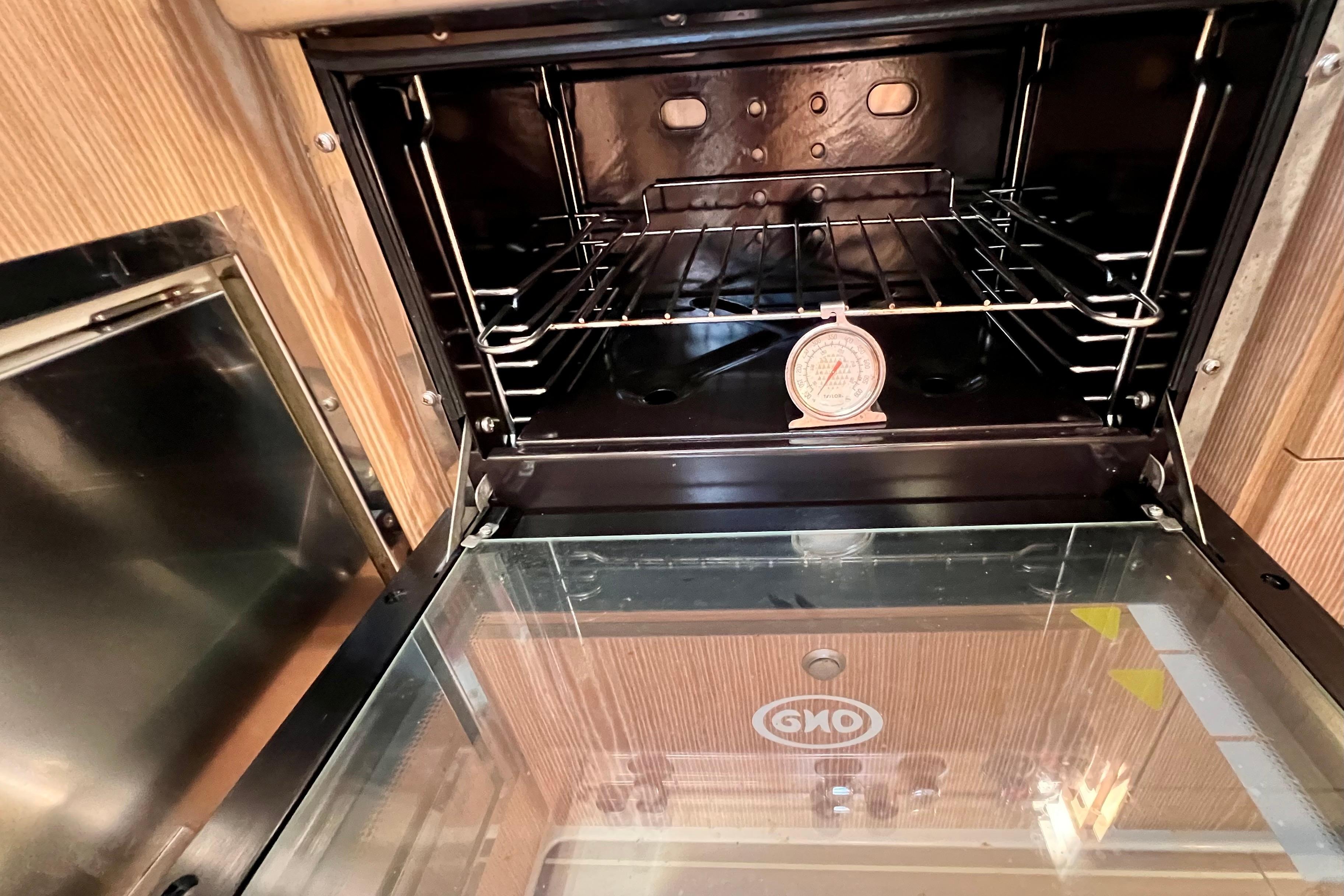 Open oven with thermometer inside, aboard a 2016 Hanse 455 yacht.