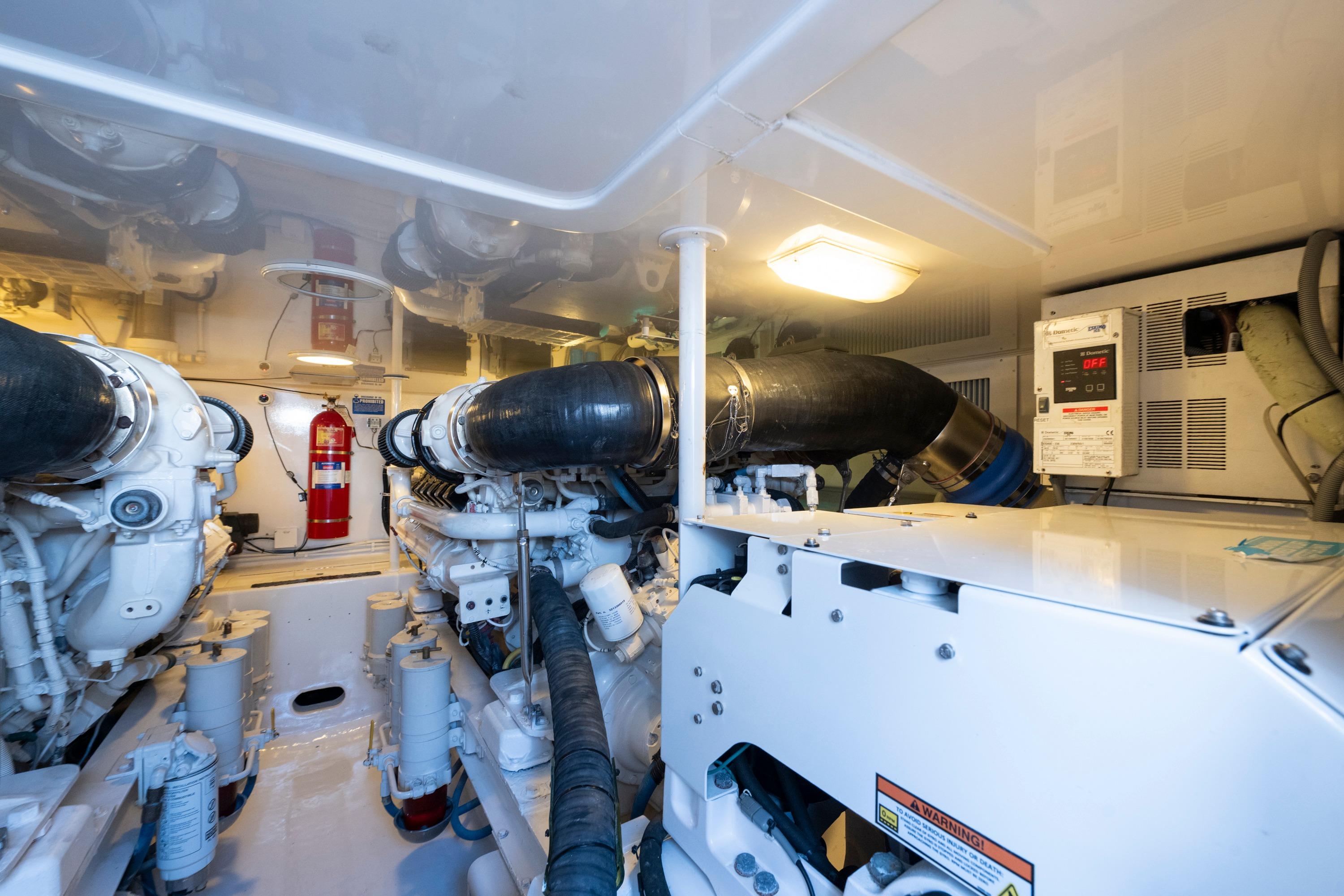 Engine room of 2009 Viking 50 Convertible yacht, featuring machinery and equipment.