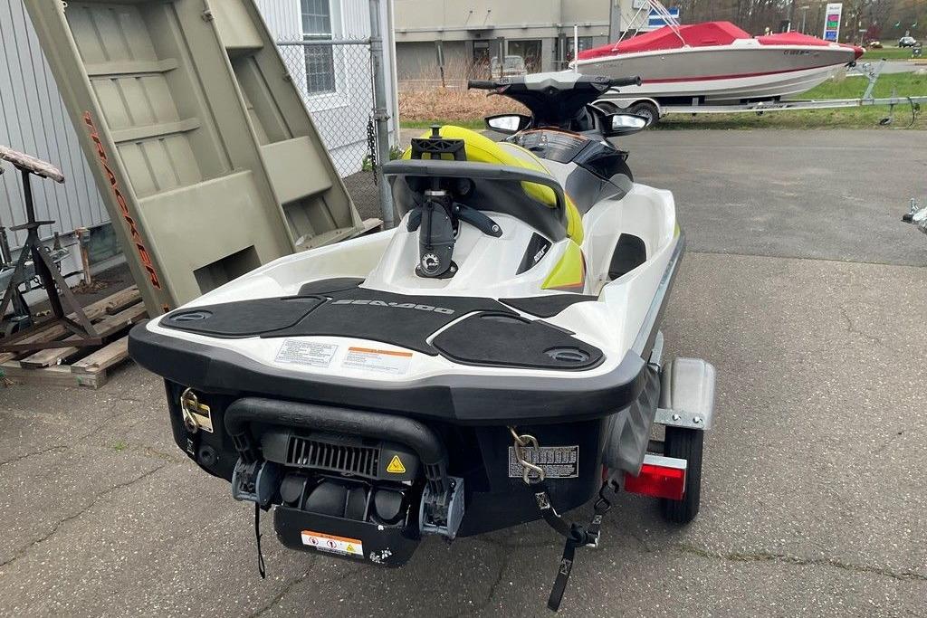 2014 Sea-Doo Wake Pro 215 jet ski on trailer, parked outdoors.