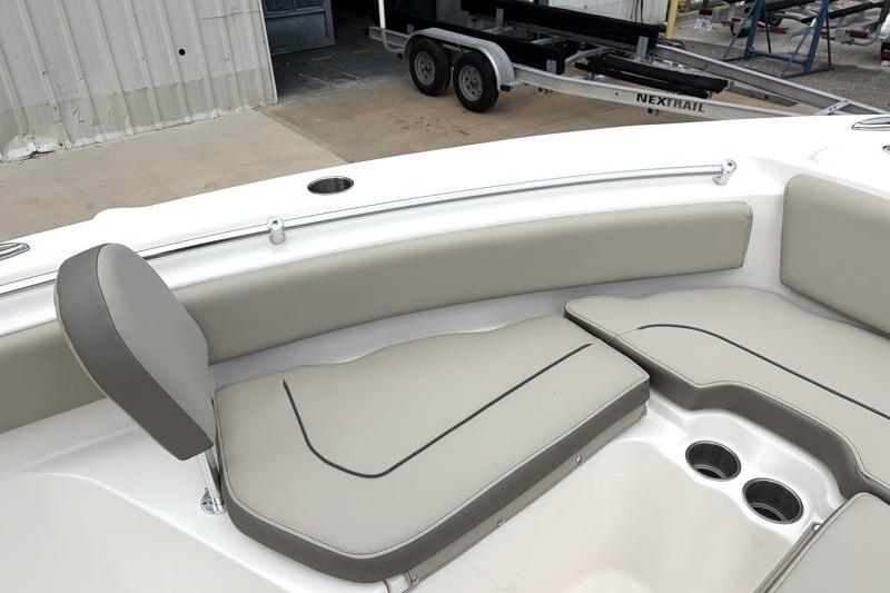 2024 Key West 239 FS boat interior with cushioned seating and cup holders.