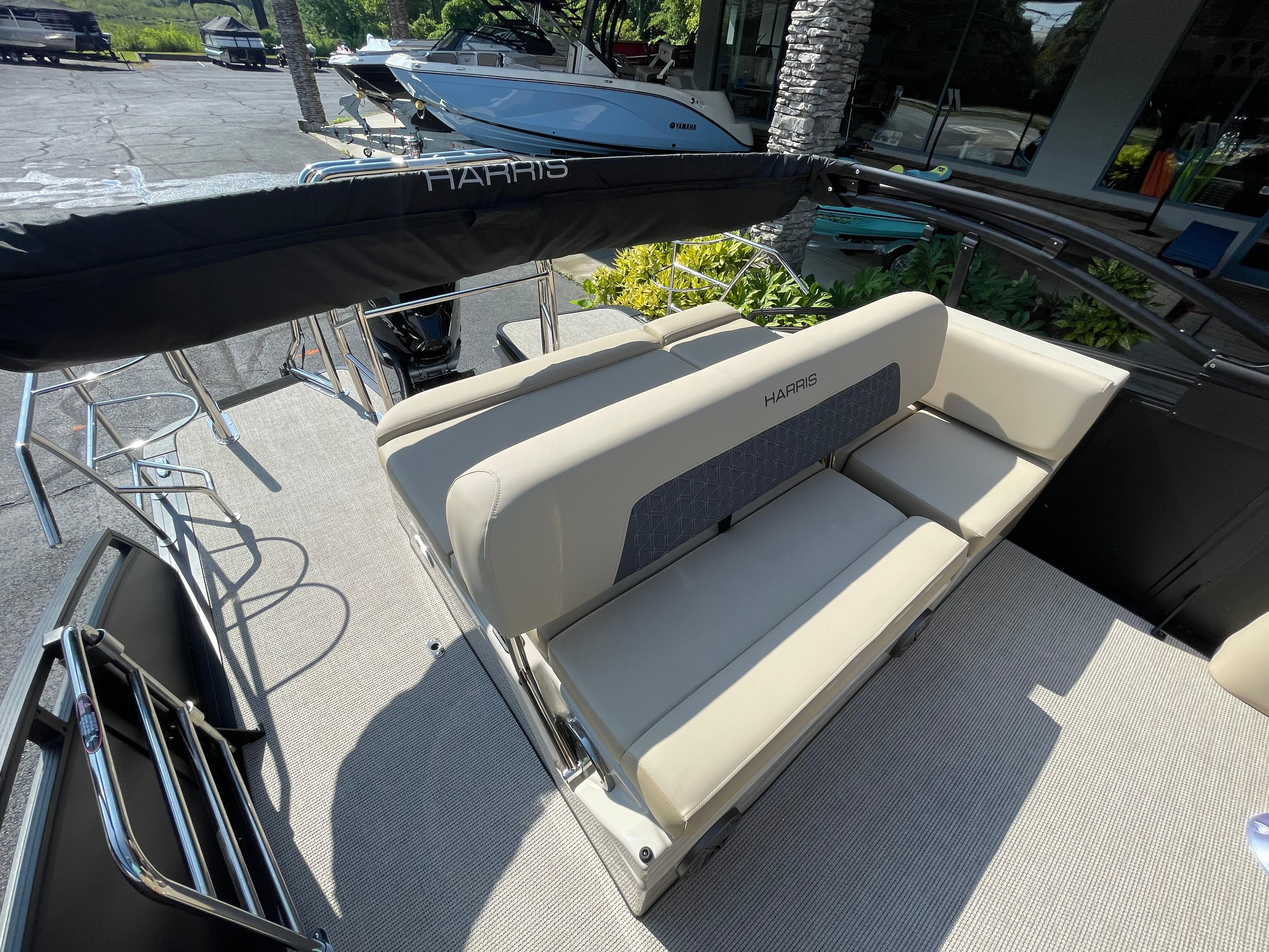 2026 Harris Solstice 230 boat interior with beige seating and sleek design.