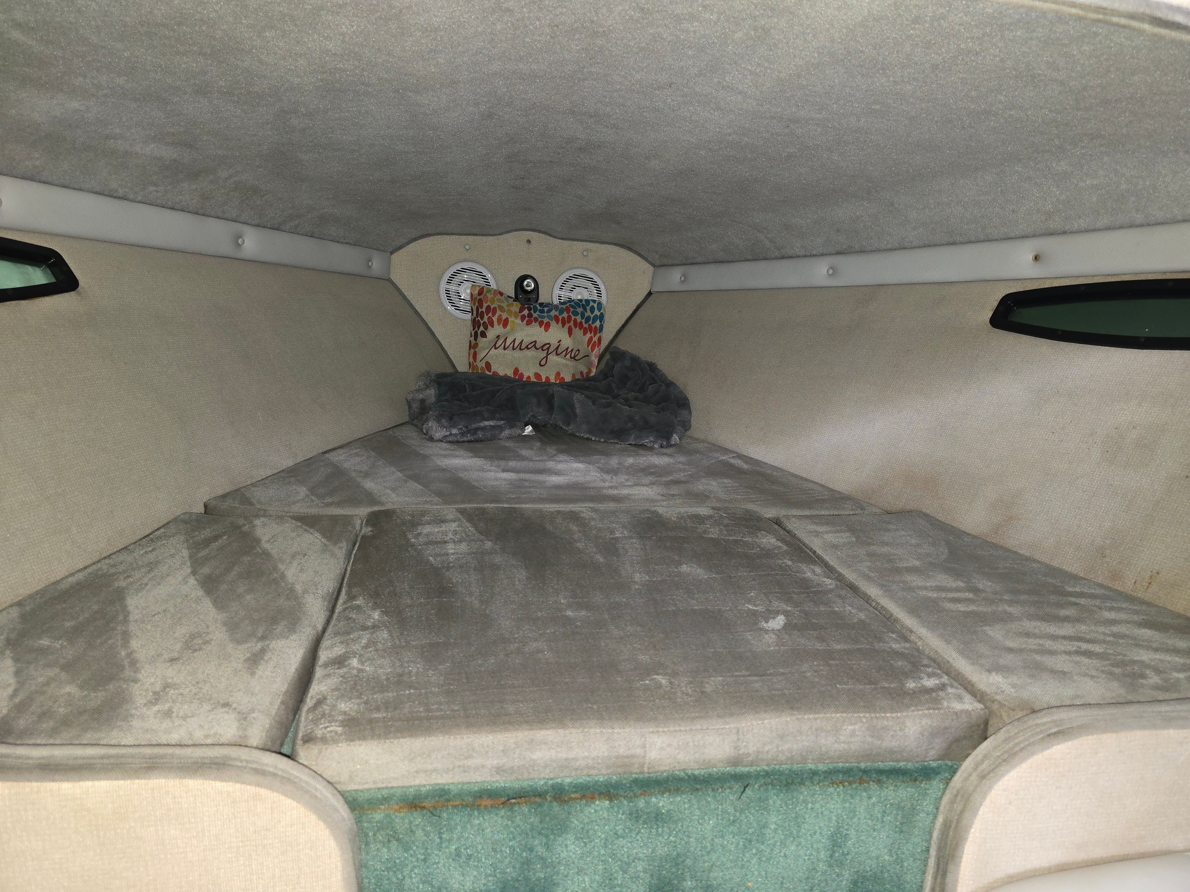Interior of a 1989 Baja 280 Sport boat with gray upholstery.