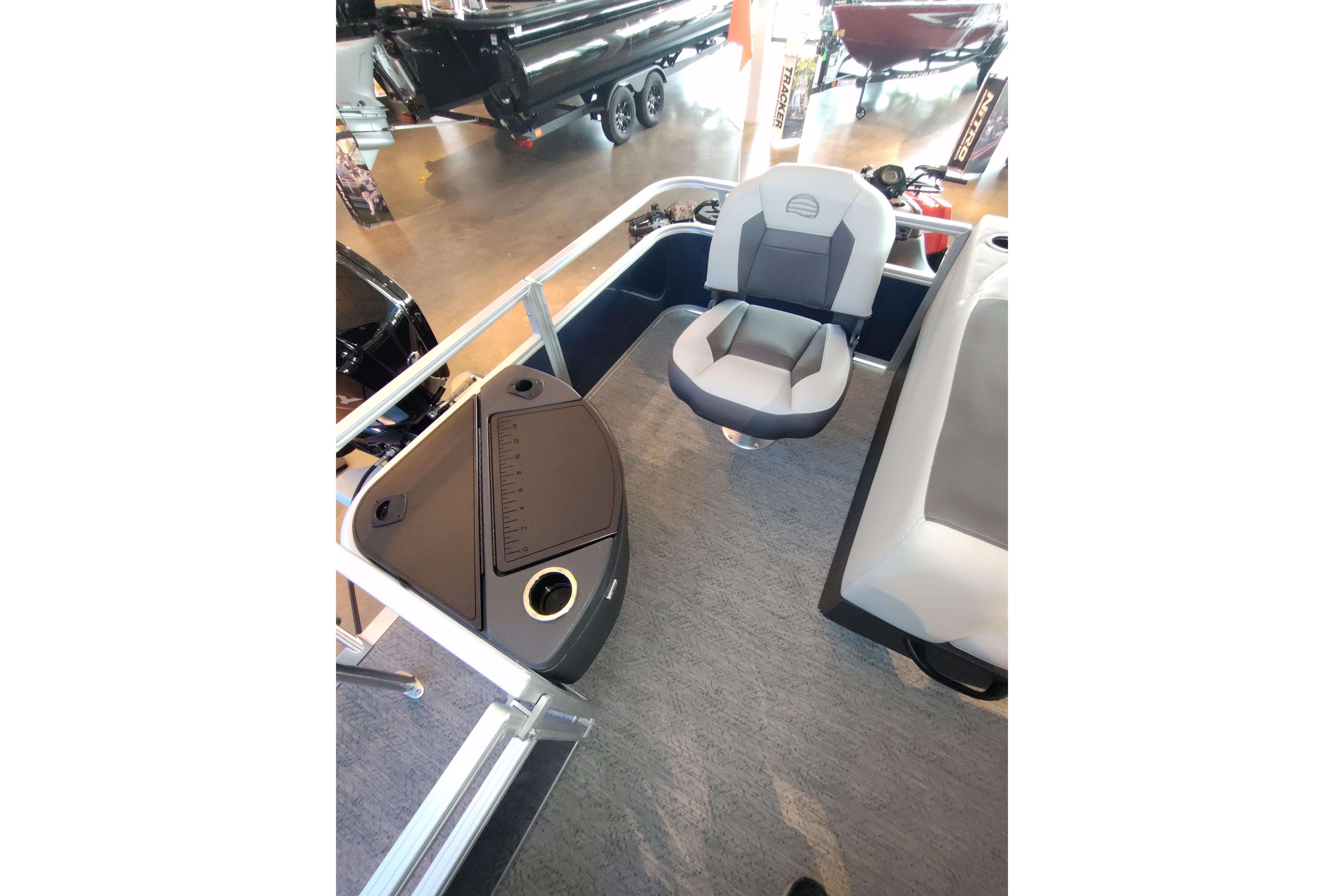 2026 Sun Tracker Bass Buggy 18 DLX interior with seating and storage compartments.