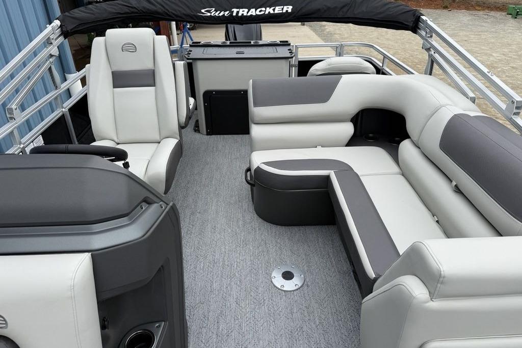 2026 Sun Tracker Fishin' Barge 20 DLX interior with plush seating and modern design.