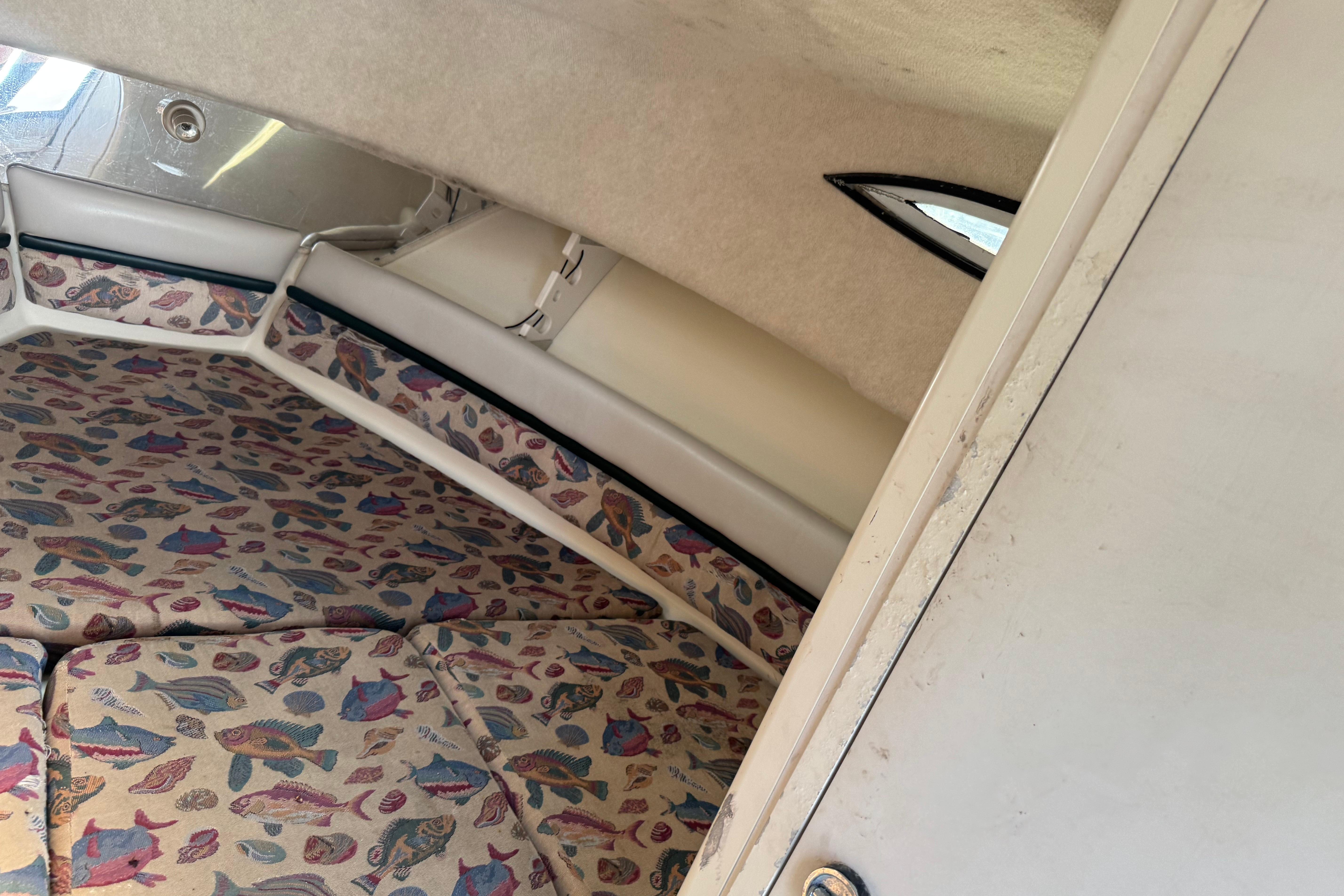 1997 Hydra-Sports VECTOR 2650 WA cabin interior with fish-patterned upholstery.