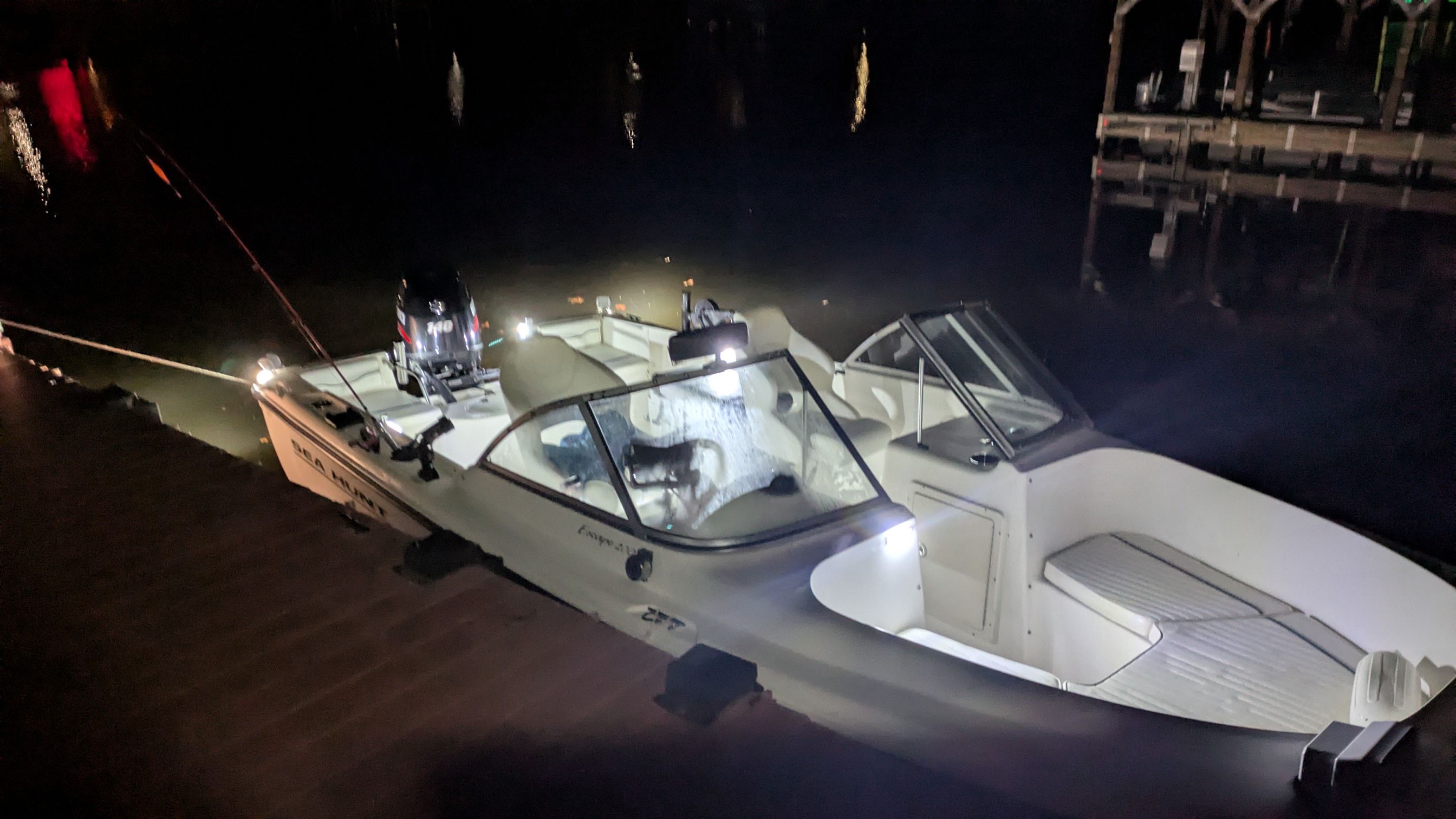 Sea Hunt Escape 200 boat at night dock, year 2000.