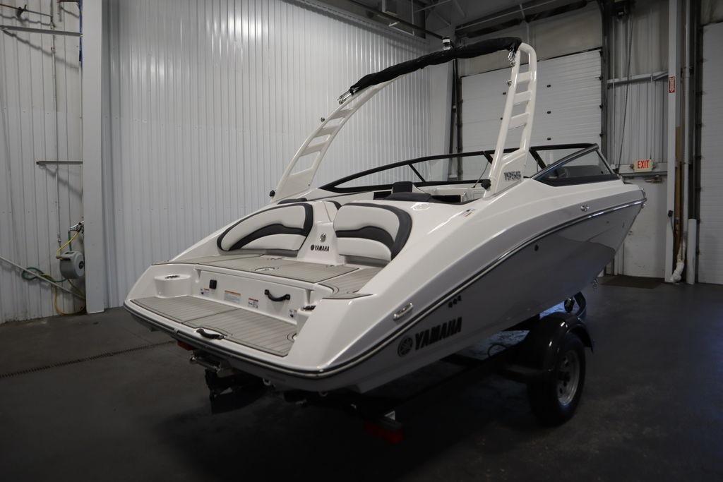 2026 Yamaha Boats 195S in a garage, showcasing sleek design and modern features.