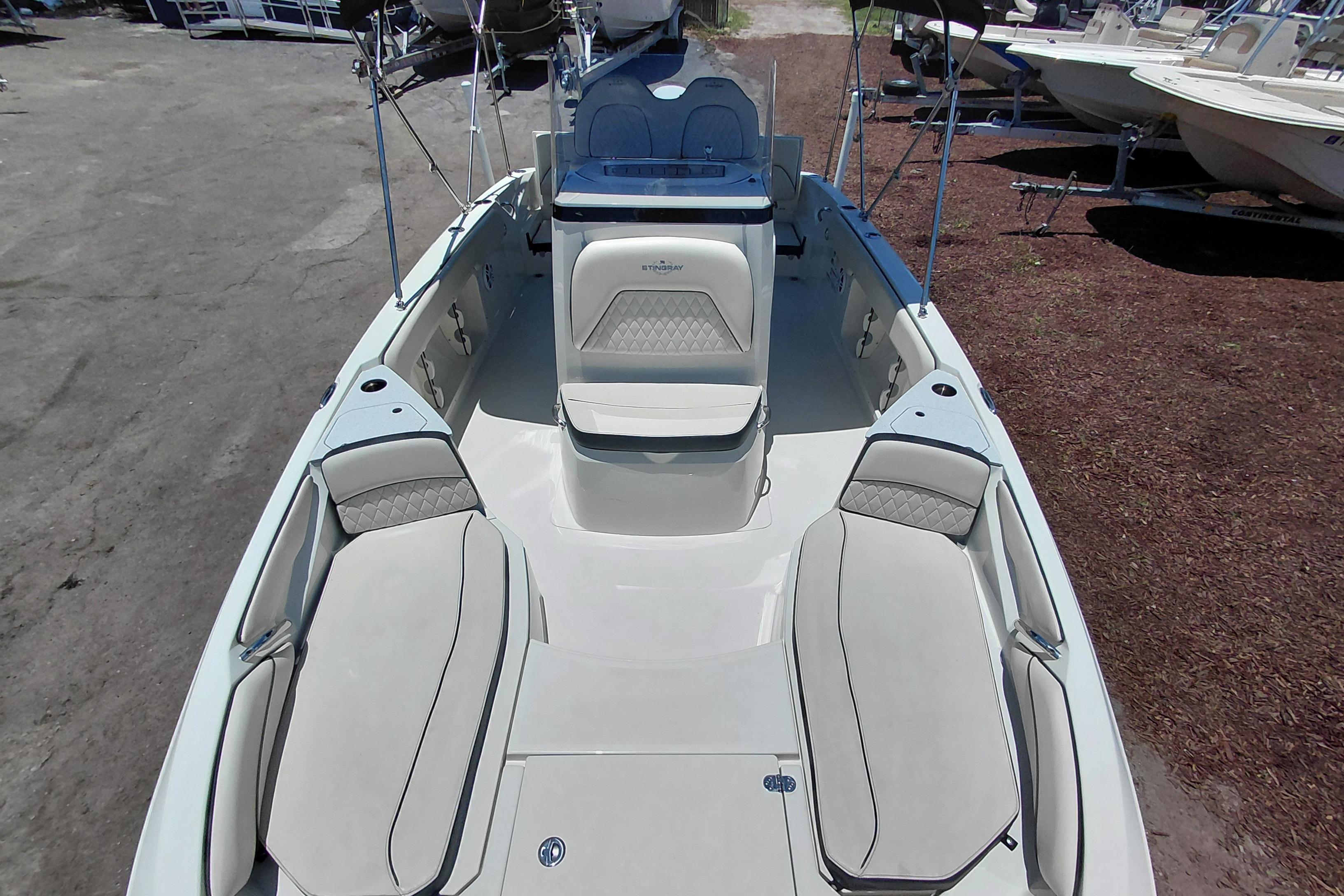2023 Stingray 206 CC boat interior with cushioned seating and sleek design.