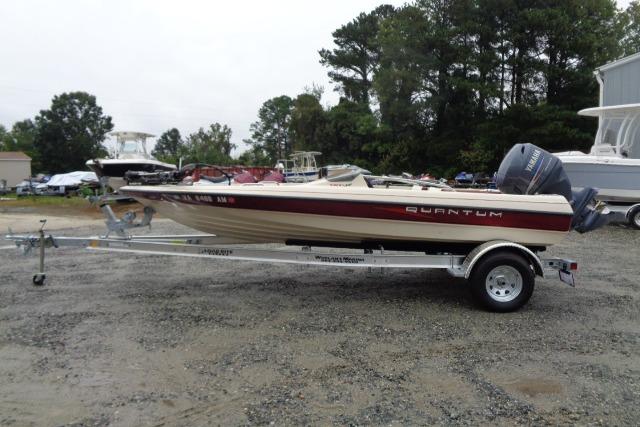 1996 Quantum 180 XD boat on trailer, parked outdoors with trees in background.