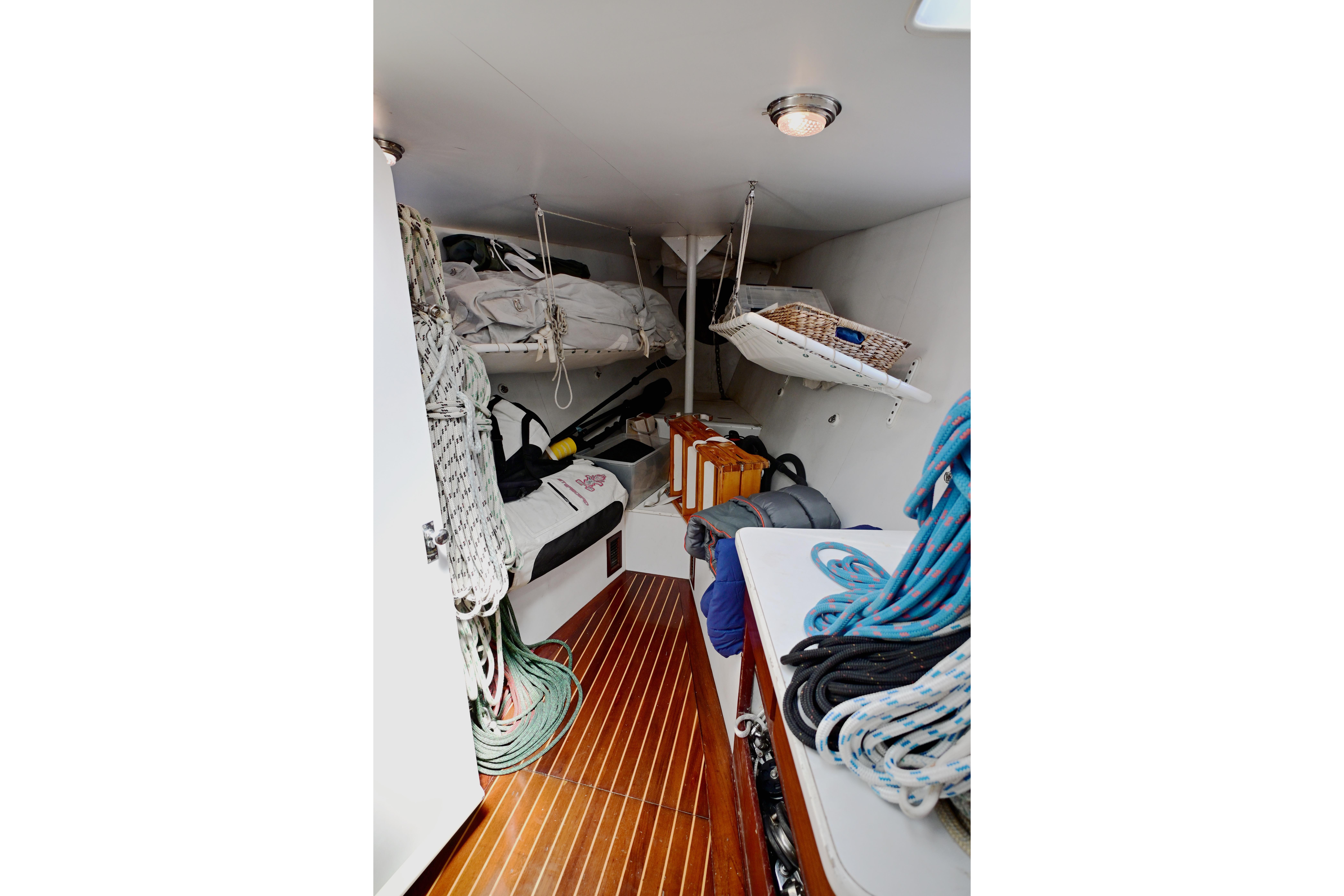 Interior of 1968 Abeking & Rasmussen Tripp 74 yacht with ropes and storage.