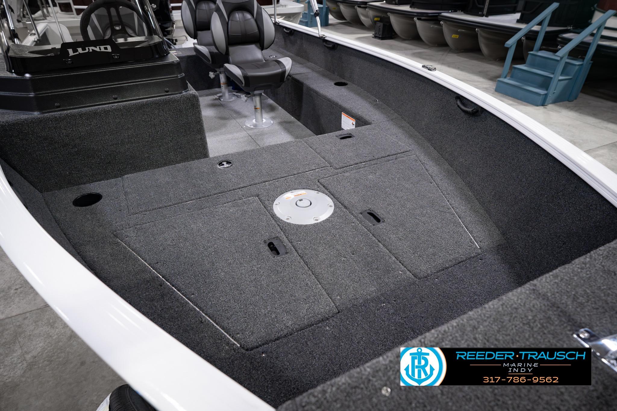 2026 Lund 1650 Rebel XL SS boat interior with seating and storage compartments.