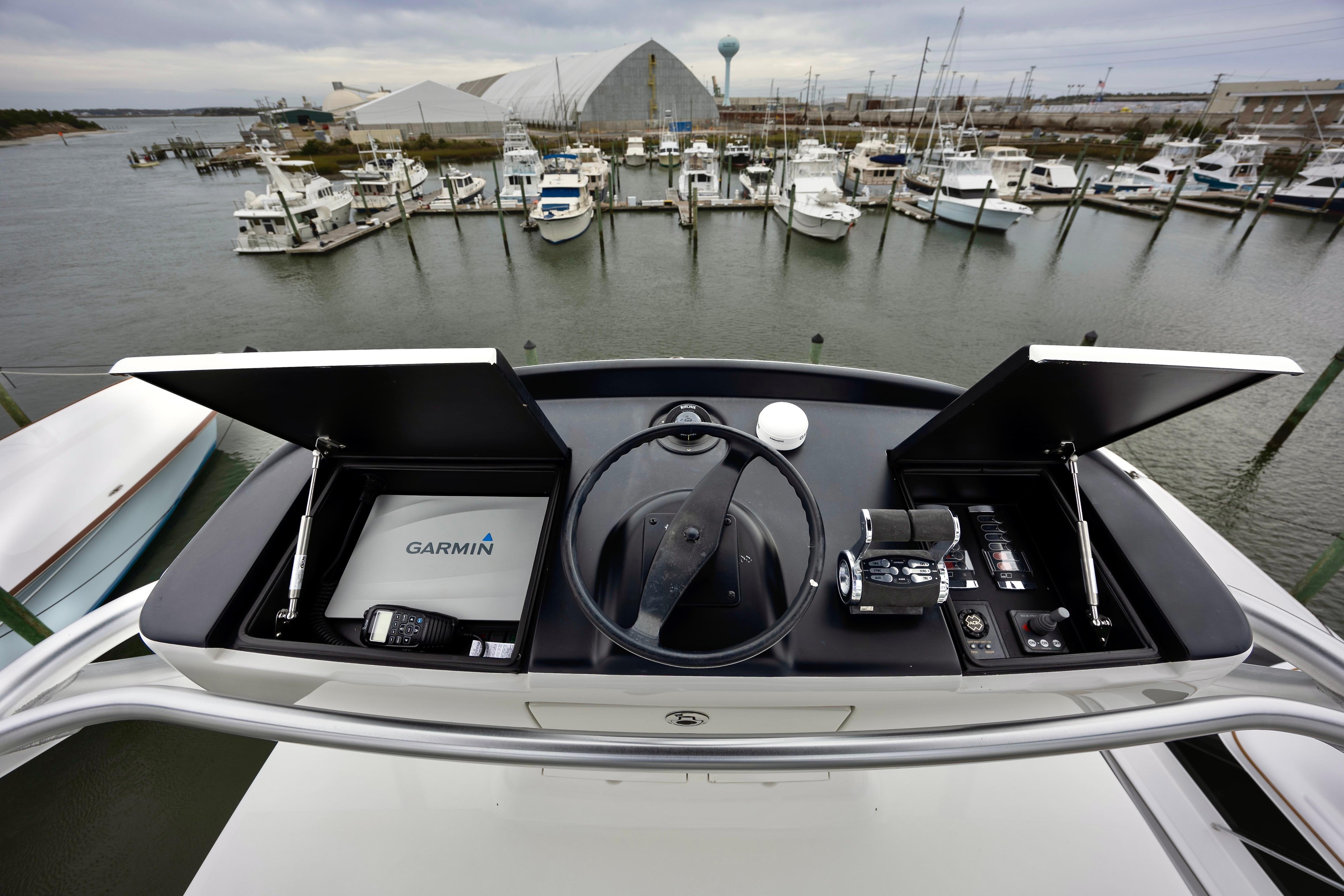 Cockpit view of 2019 Viking 68 Convertible yacht with Garmin navigation system.