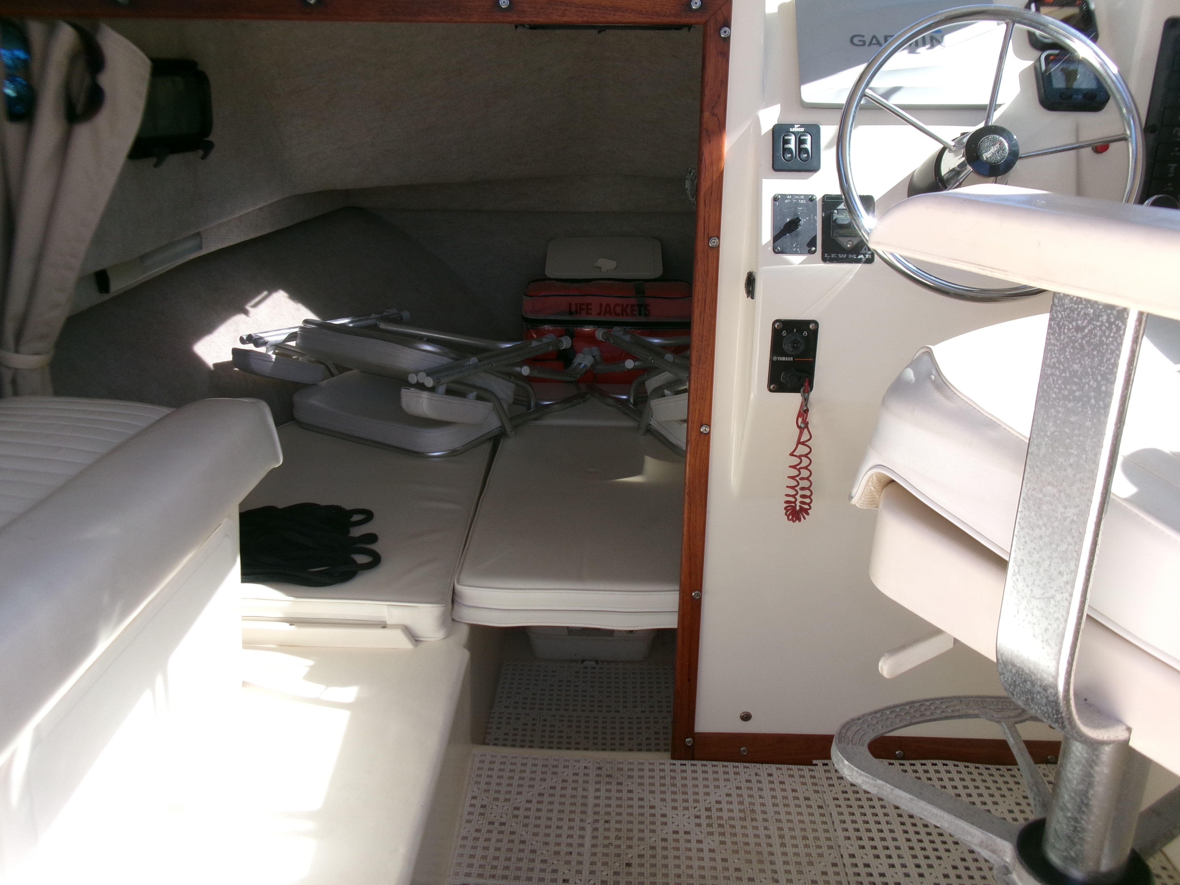 Interior of a 2007 Parker 2520 XL Sport Cabin with helm and seating area.