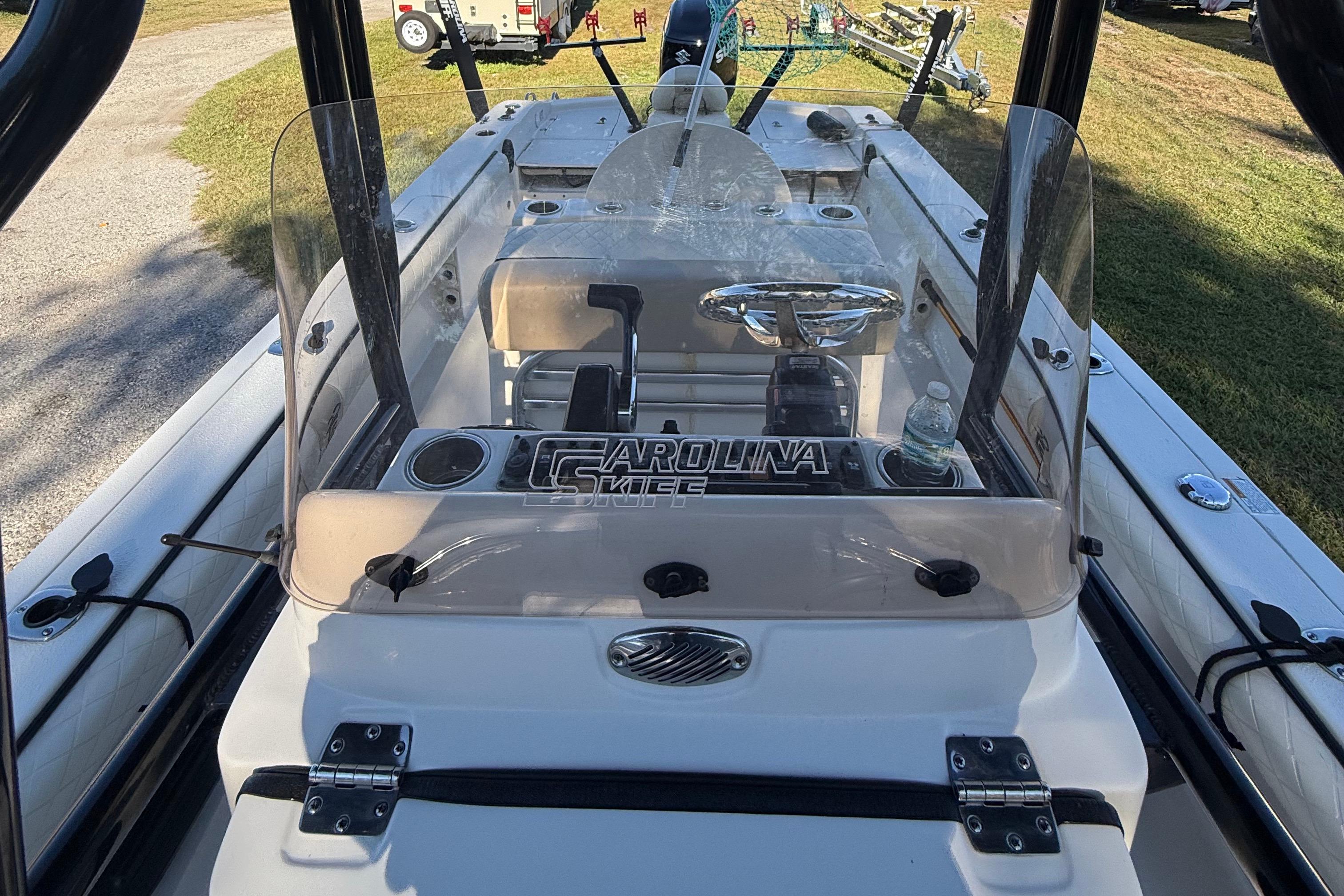 2021 Carolina Skiff 26 Ultra Elite boat interior with steering console and windshield.