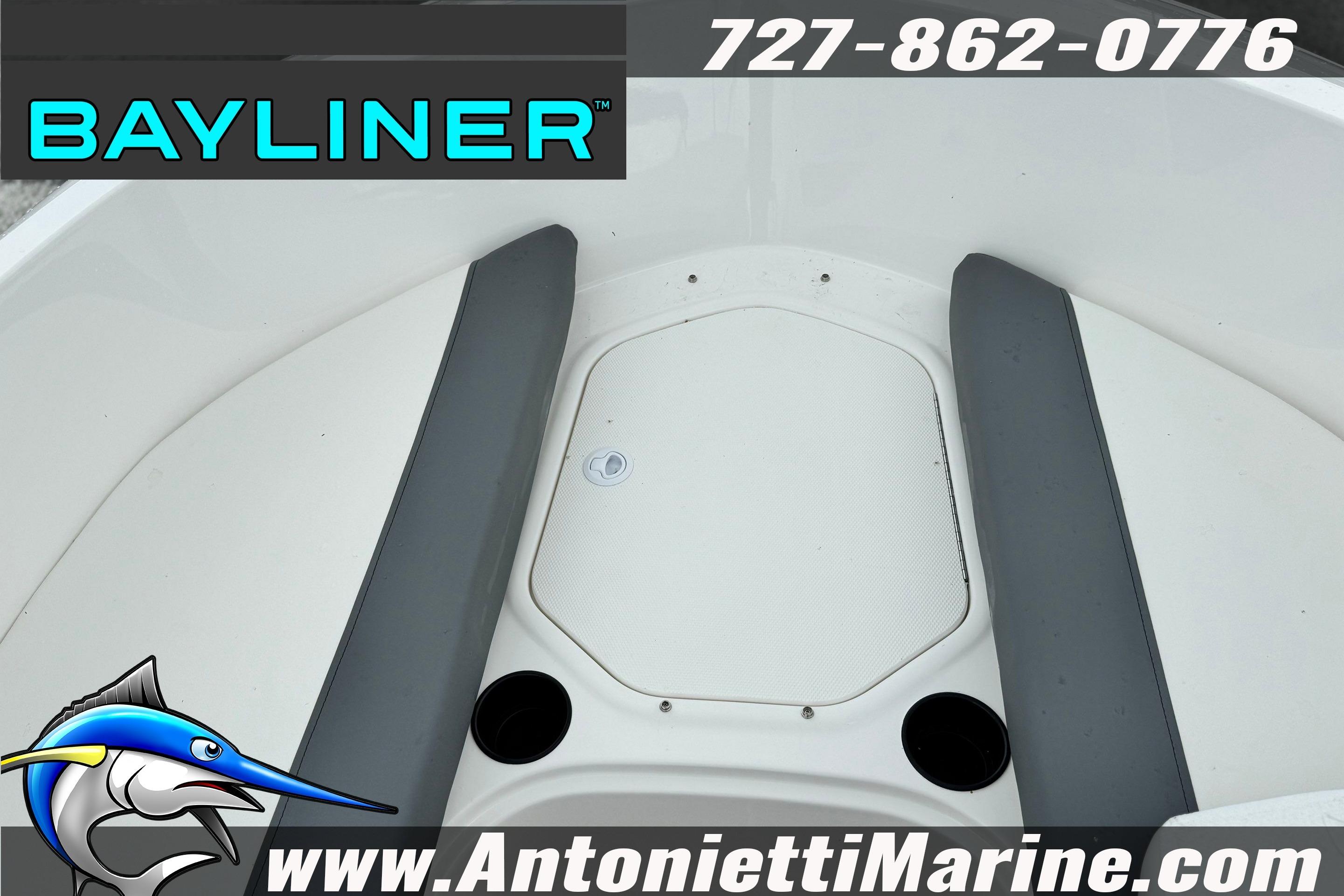 Bayliner Element E16 boat interior with seating, logo, and contact information.
