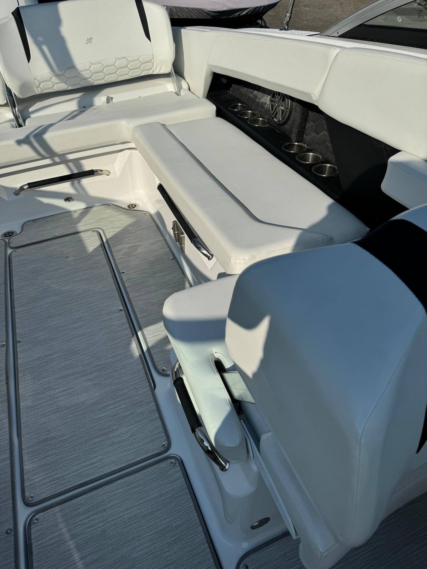 2025 Four Winns H6 OB boat interior with white seating and sleek design.