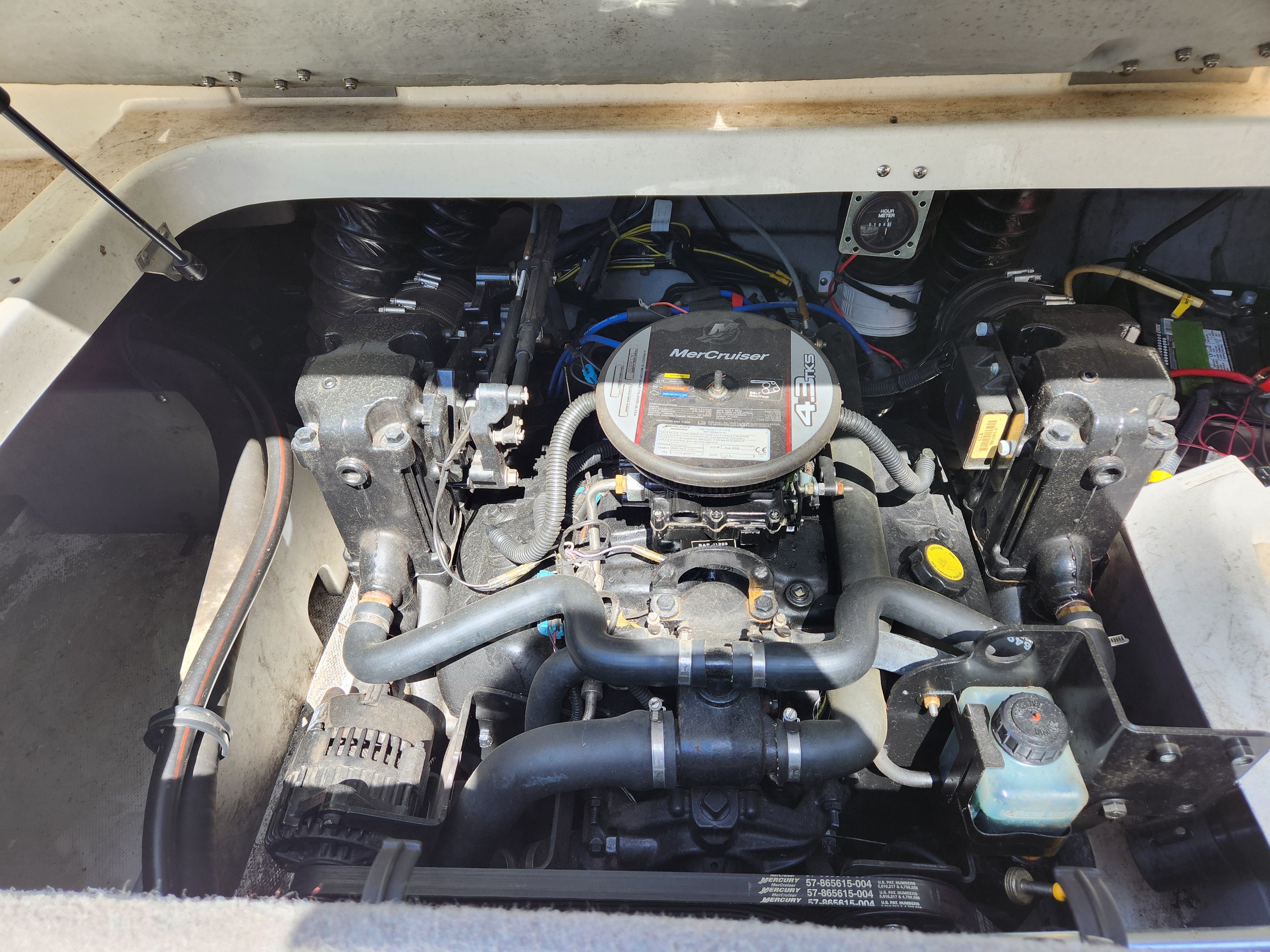 Engine compartment of a 2009 Bayliner 194SF with a MerCruiser engine.