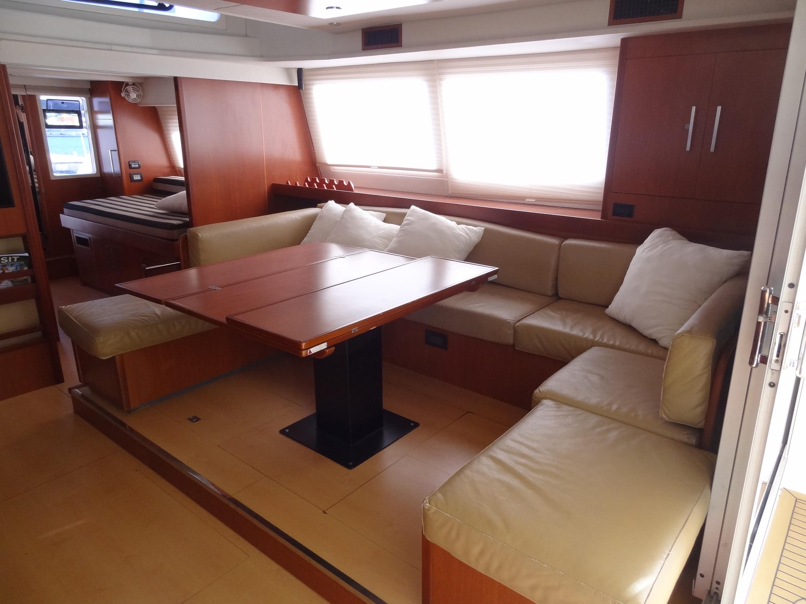 Luxurious 2014 Leopard 58 yacht interior with spacious seating and dining area.