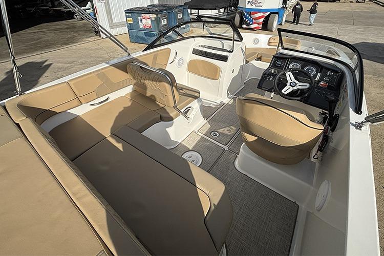 2023 Bayliner VR5 Bowrider OB interior with beige seating and modern dashboard.