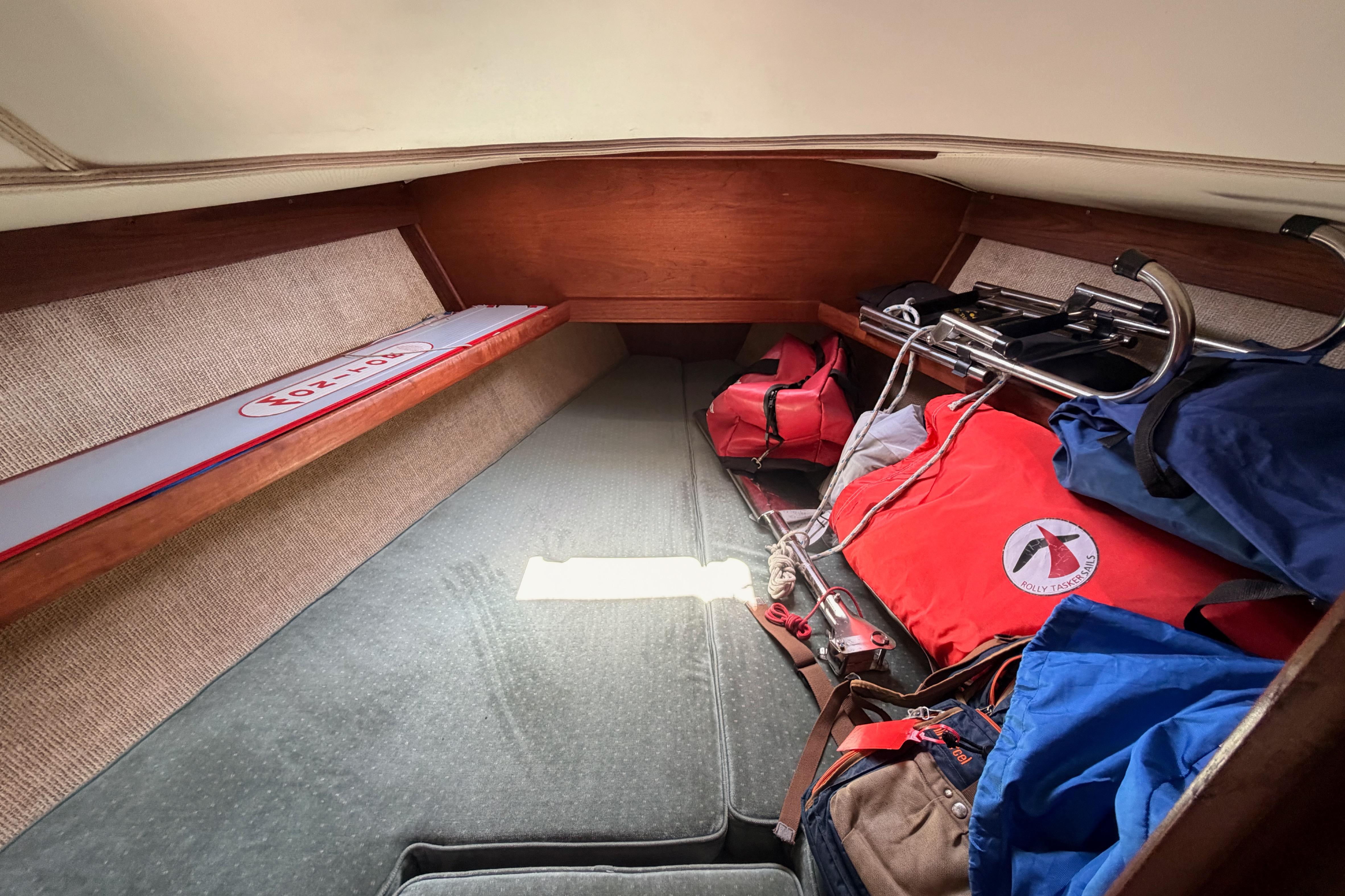 Interior cabin of a 1991 Caliber 33 sailboat with storage and equipment.