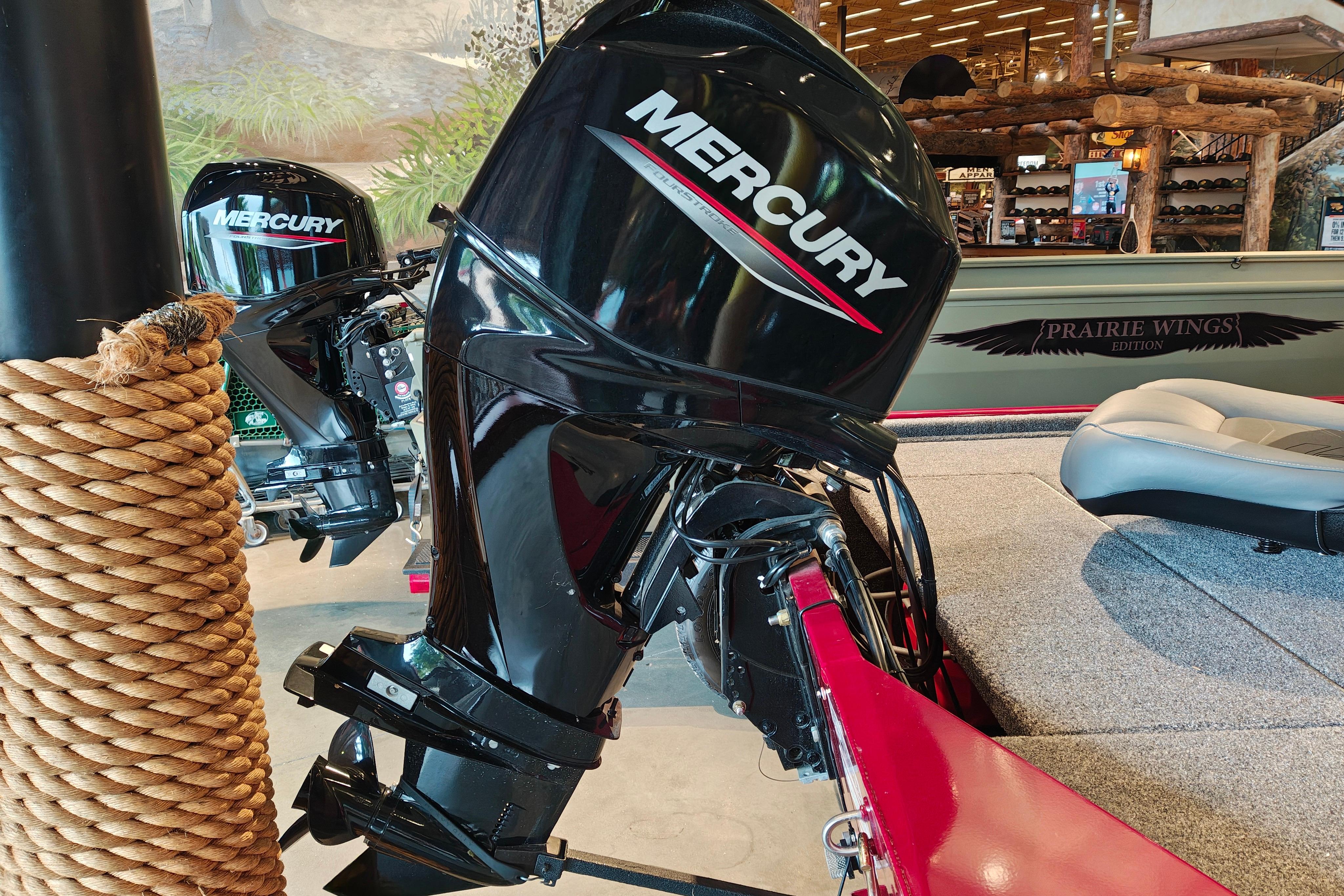 2026 Tracker Bass Tracker Classic XL with Mercury outboard motor in showroom display.