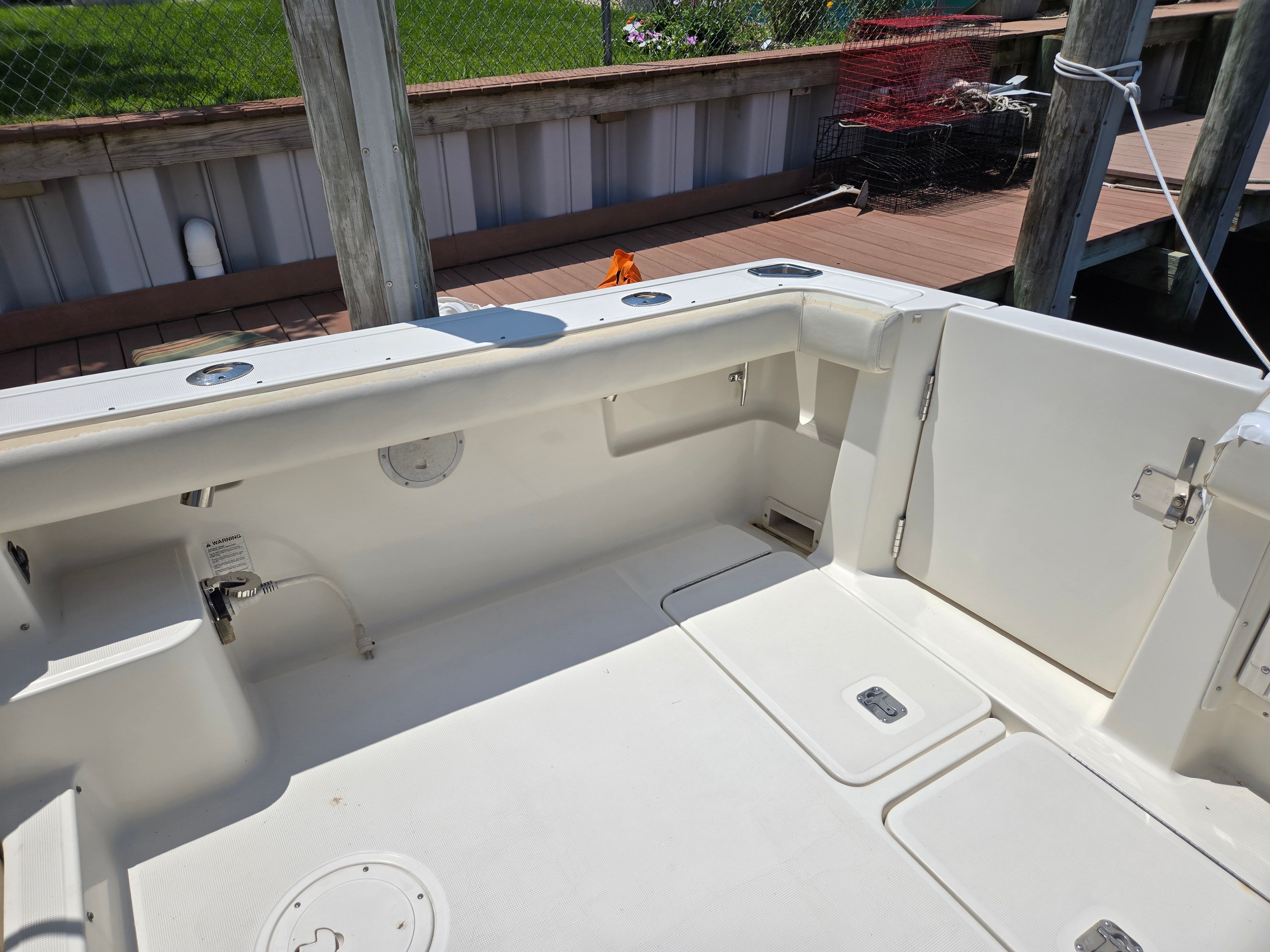 The image shows the cockpit of a 1997 Tiara Yachts Open. It is spacious and clean.