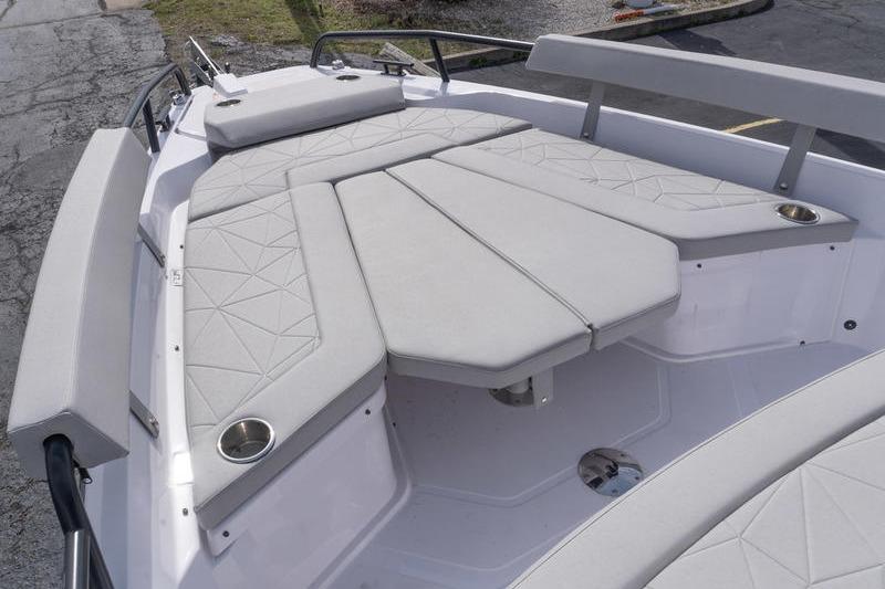 2025 Axopar 29 XC Cross Cabin boat with cushioned seating and cup holders.