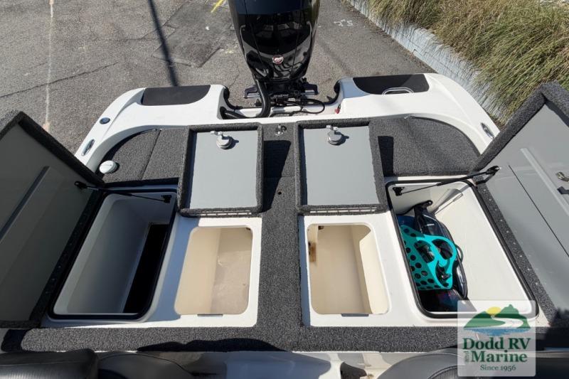 2021 Caymas CX 18 SS boat storage compartments and engine, displayed at Dodd RV Marine.