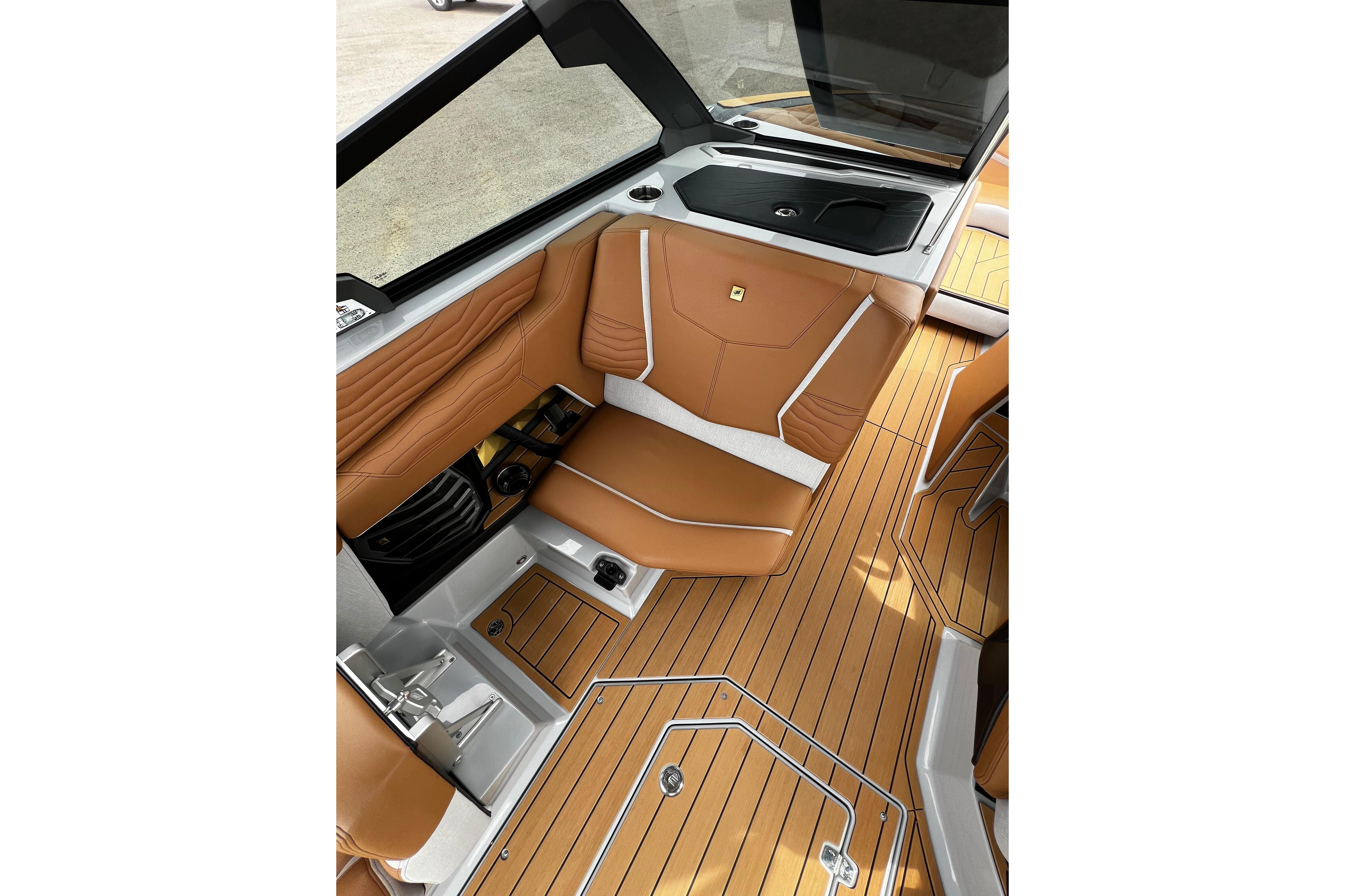 Luxurious interior of 2026 Nautique Super Air Nautique G25 with tan seating and sleek design.