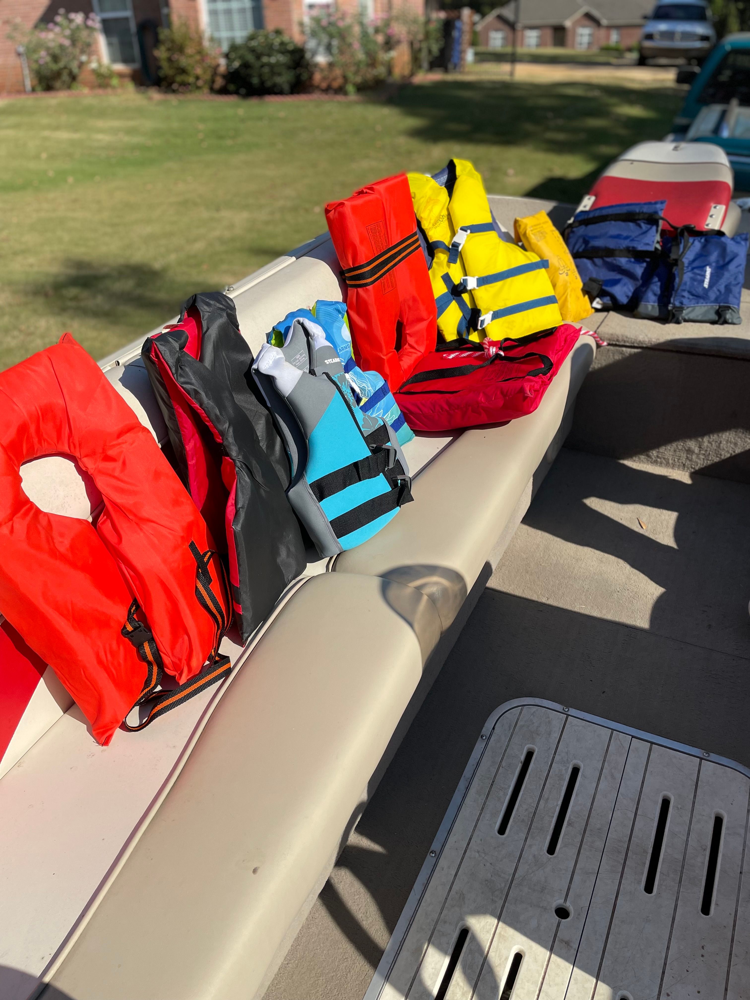 Various life jackets on a Sun Tracker Party Deck 21 I/O boat.