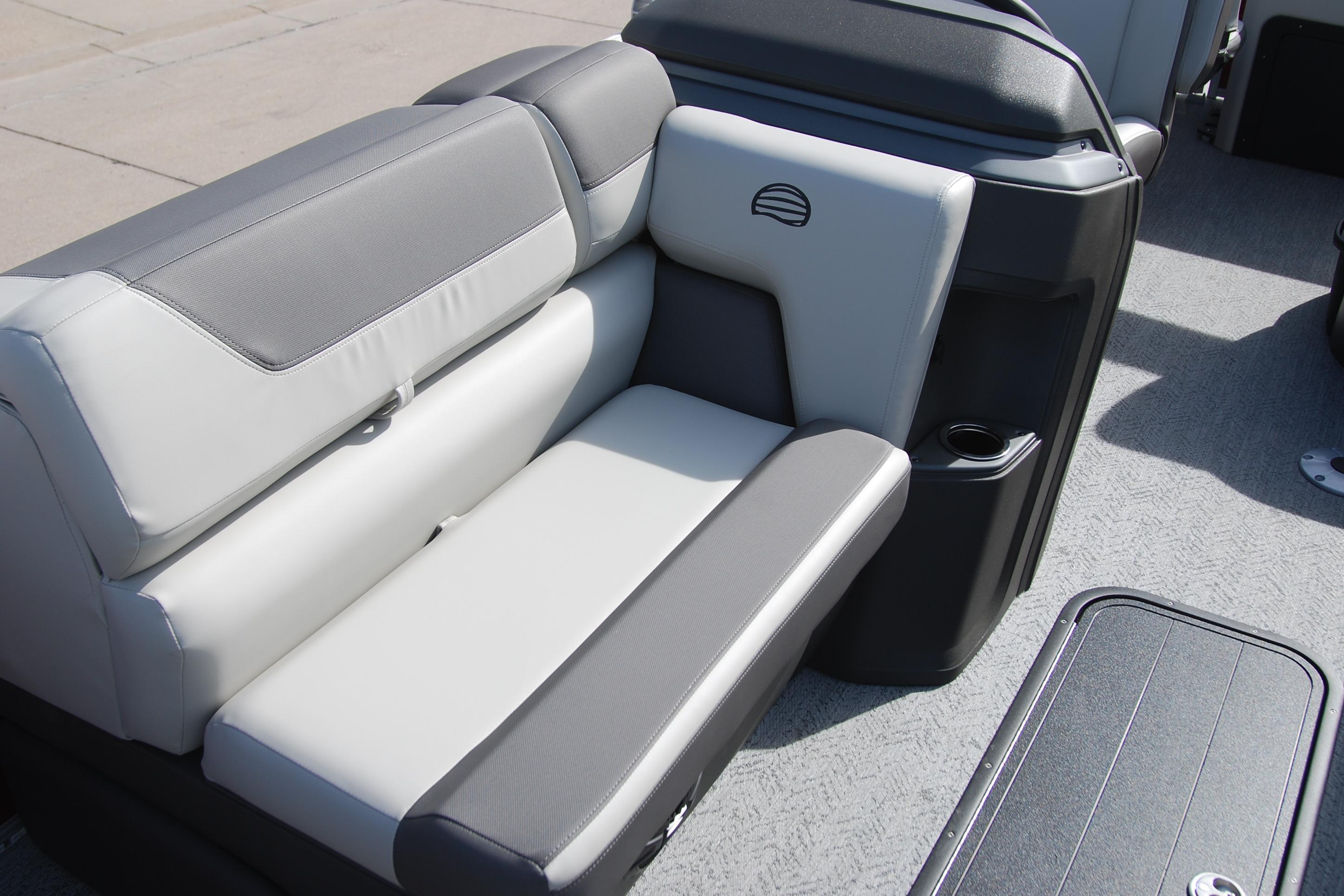 2026 Sun Tracker Fishin' Barge 22 XP3 boat seating with gray and white upholstery.