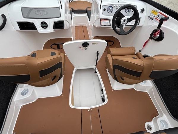 2025 Tahoe 185 S boat interior with brown seats and steering wheel.