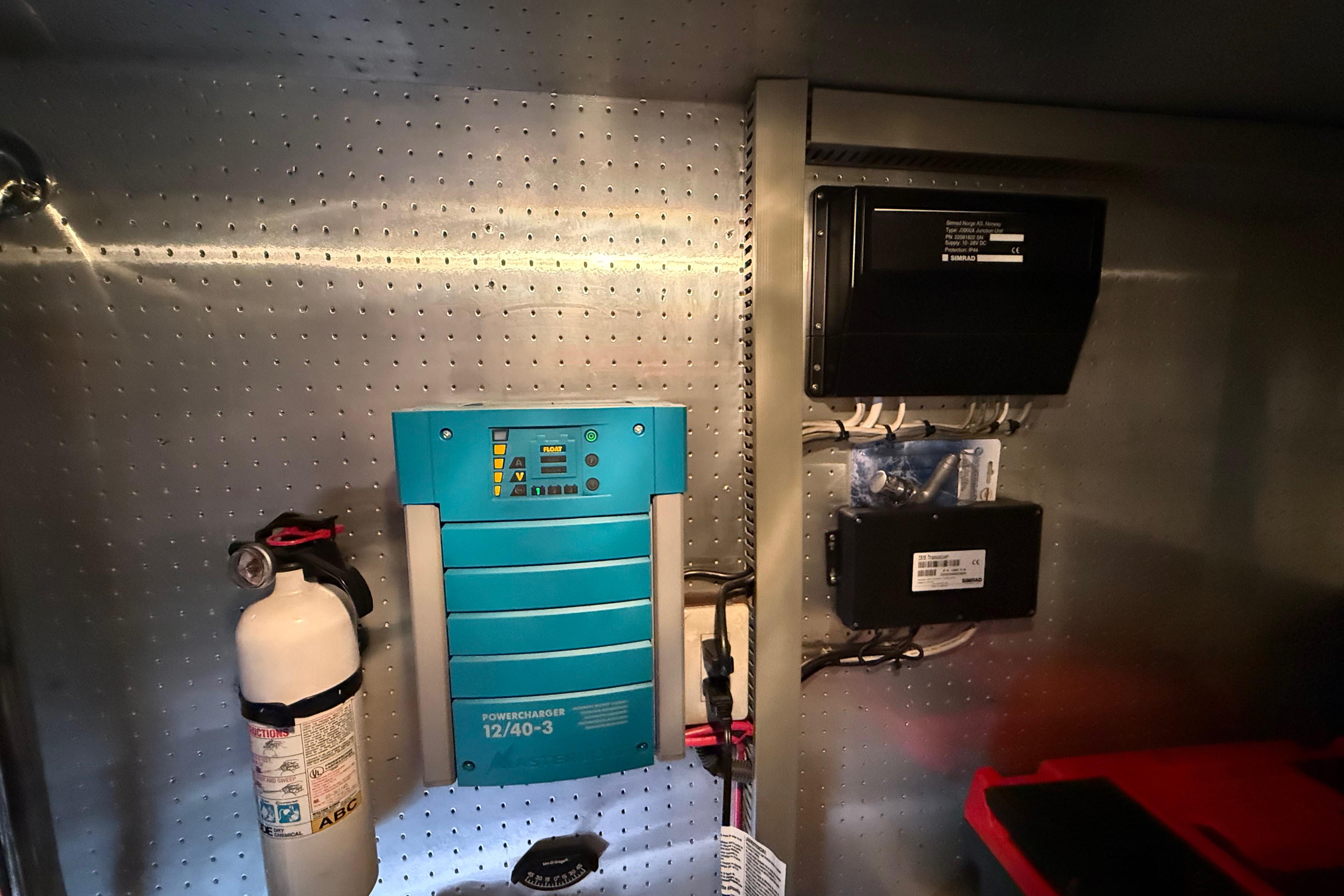Electrical panel and fire extinguisher in a 2001 Kadey-Krogen 39 yacht.