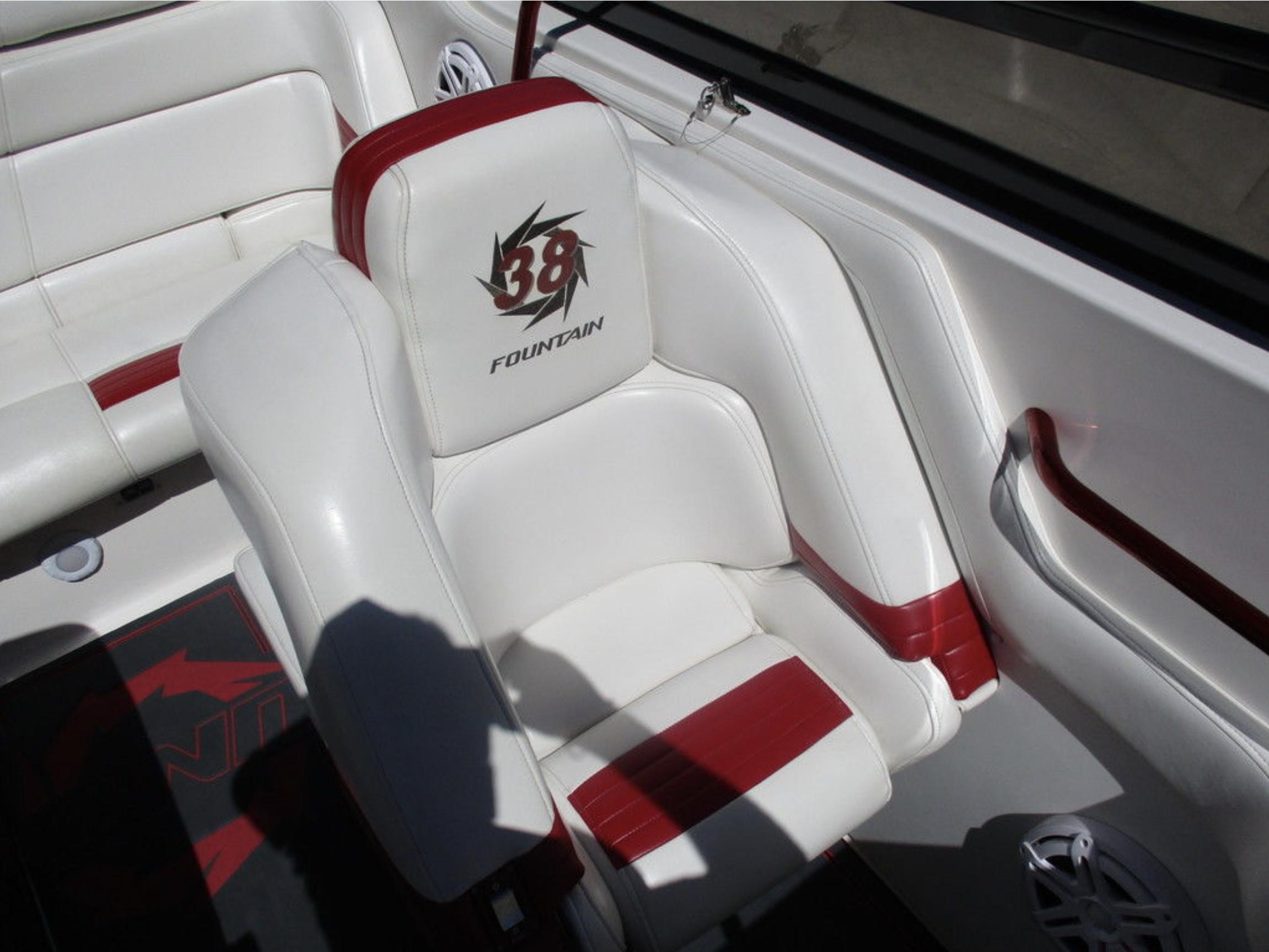 2003 Fountain 38 Lightning boat interior with white and red seating.