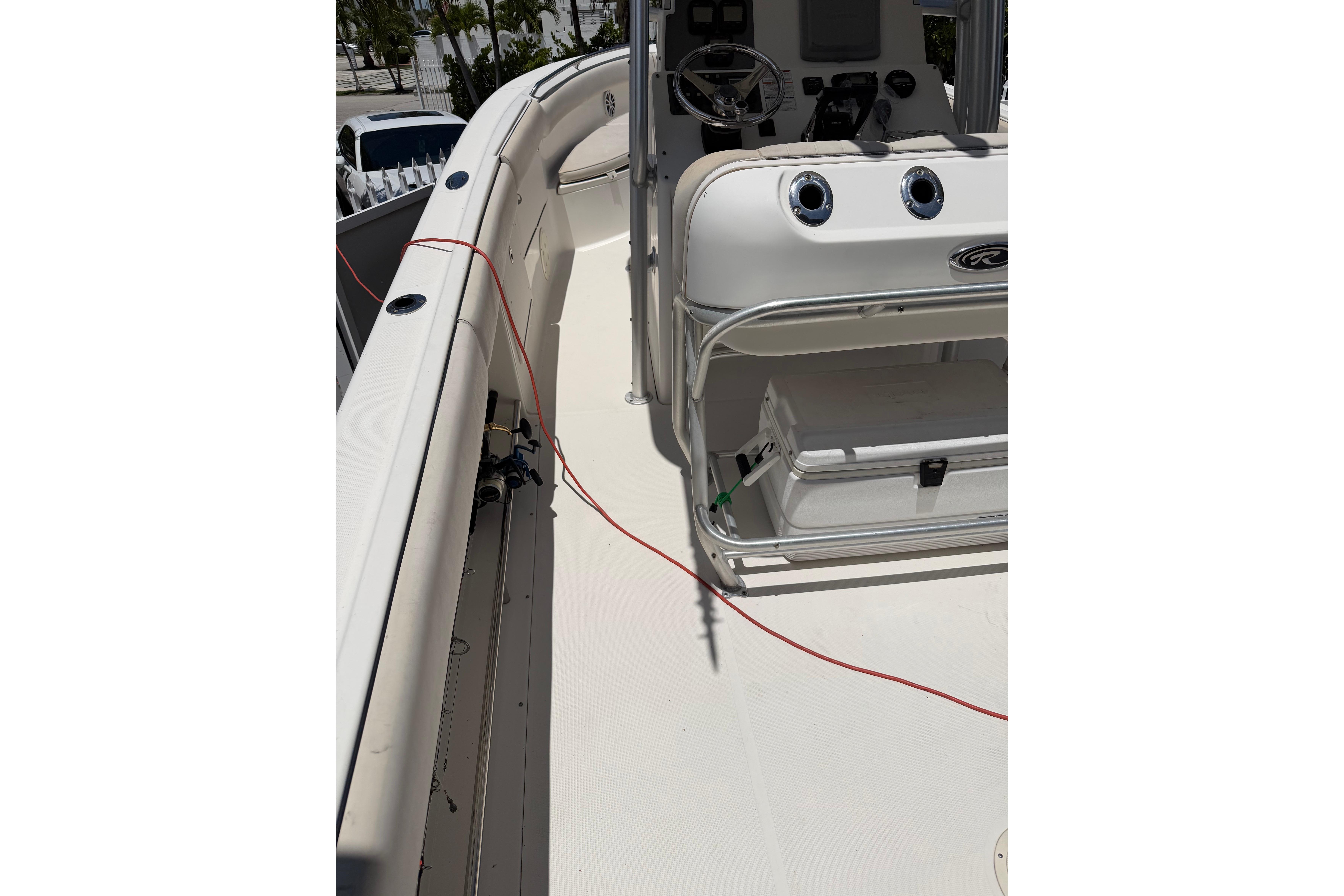 2007 Robalo R260 Center Console boat interior with steering wheel and seating area.