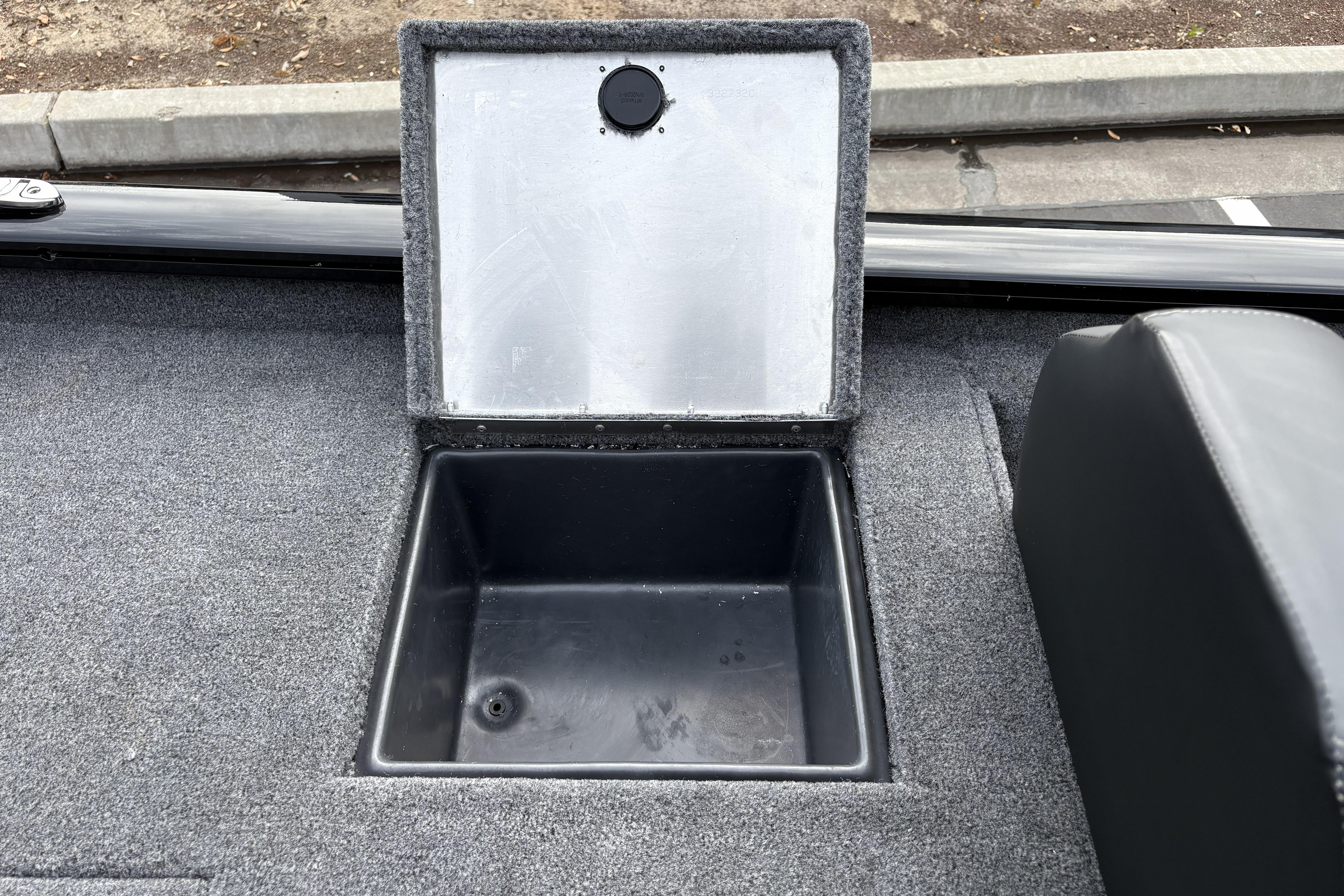 Open storage compartment on 2026 Tracker Pro Team 195 boat deck.