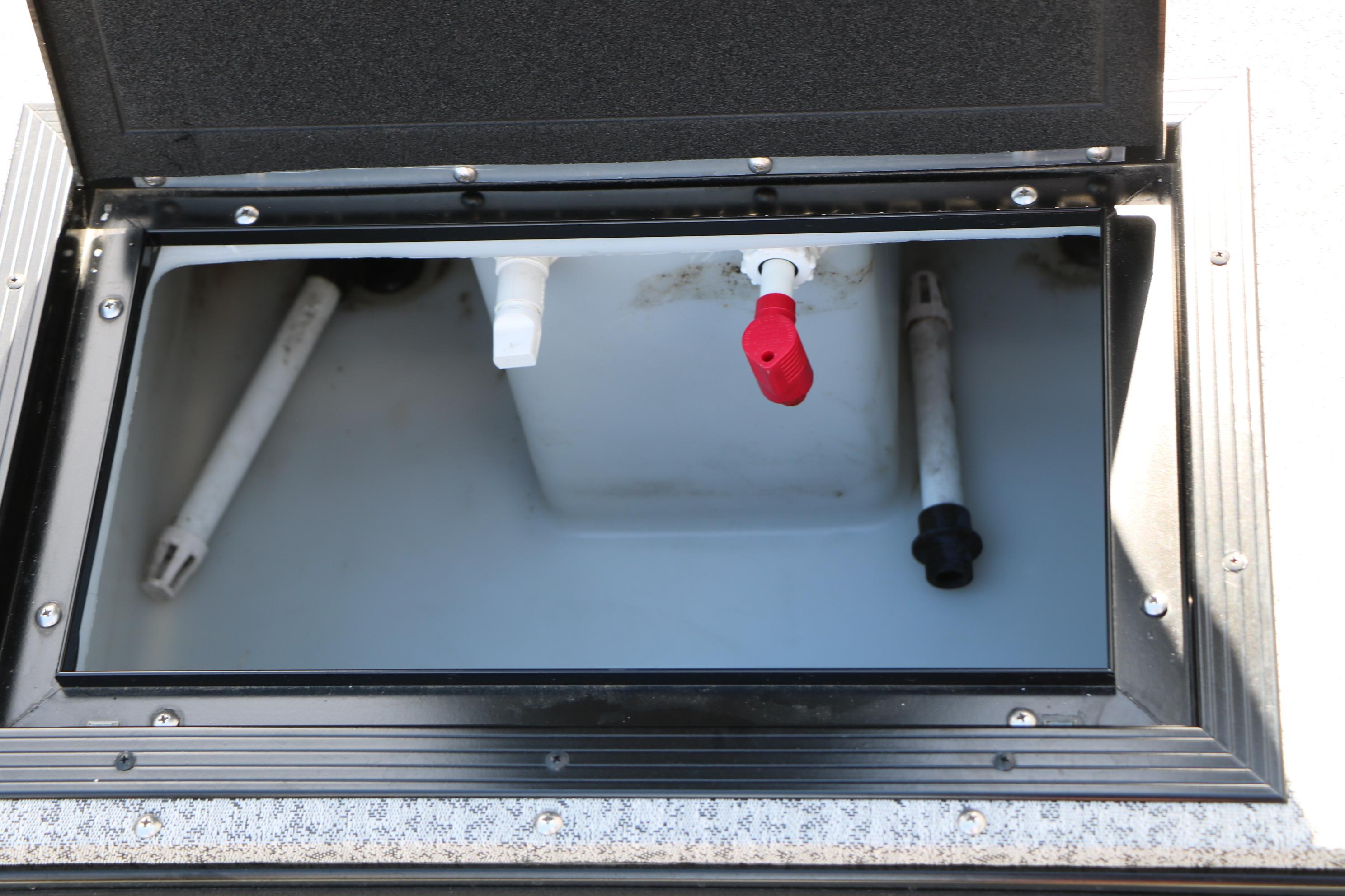 Open storage compartment on 2025 Smoker Craft Adventurer 188 DC boat.