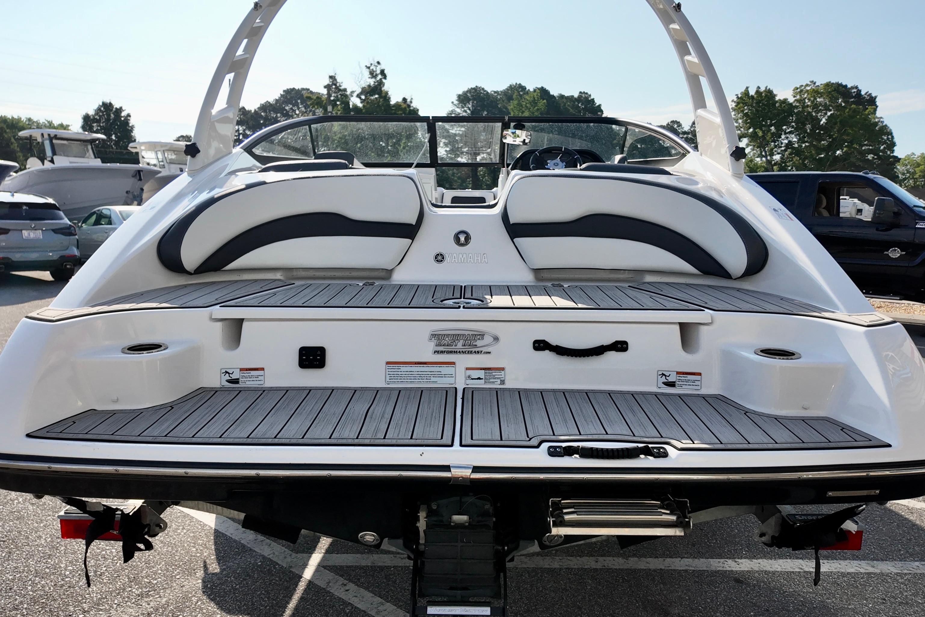 2023 Yamaha 195S boat rear view, showcasing sleek design and spacious seating.
