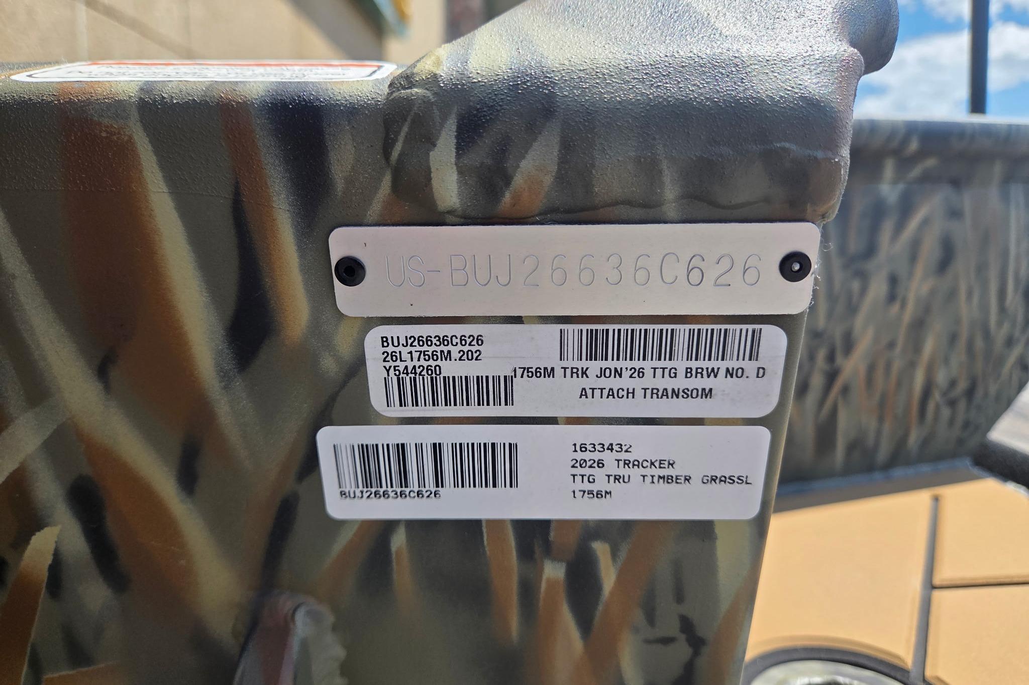 2026 Tracker Grizzly 1756 T Marsh boat identification tags on camo-patterned surface.