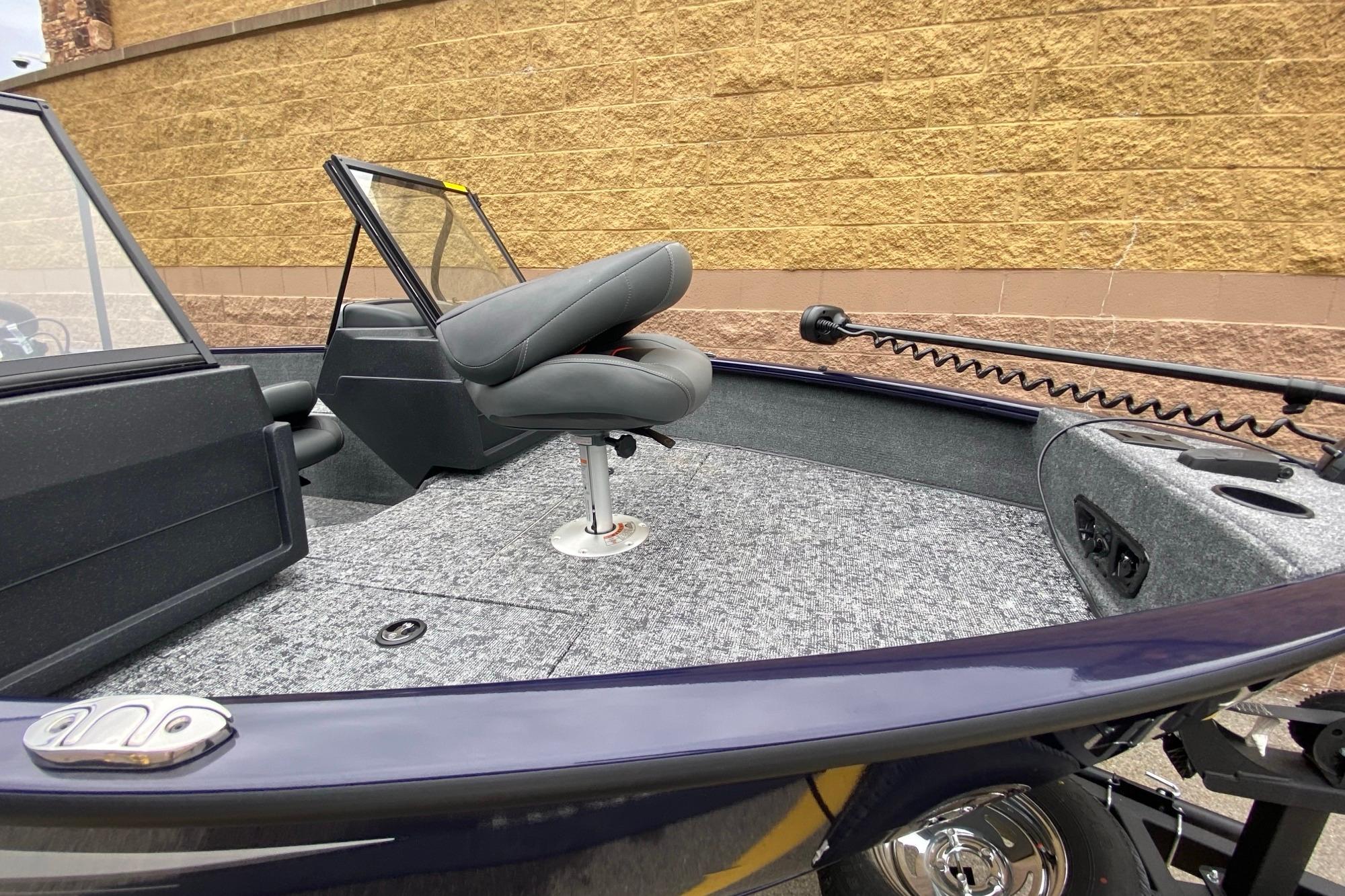 2026 Tracker Pro Guide V-175 WT boat interior with seating and carpeted deck.
