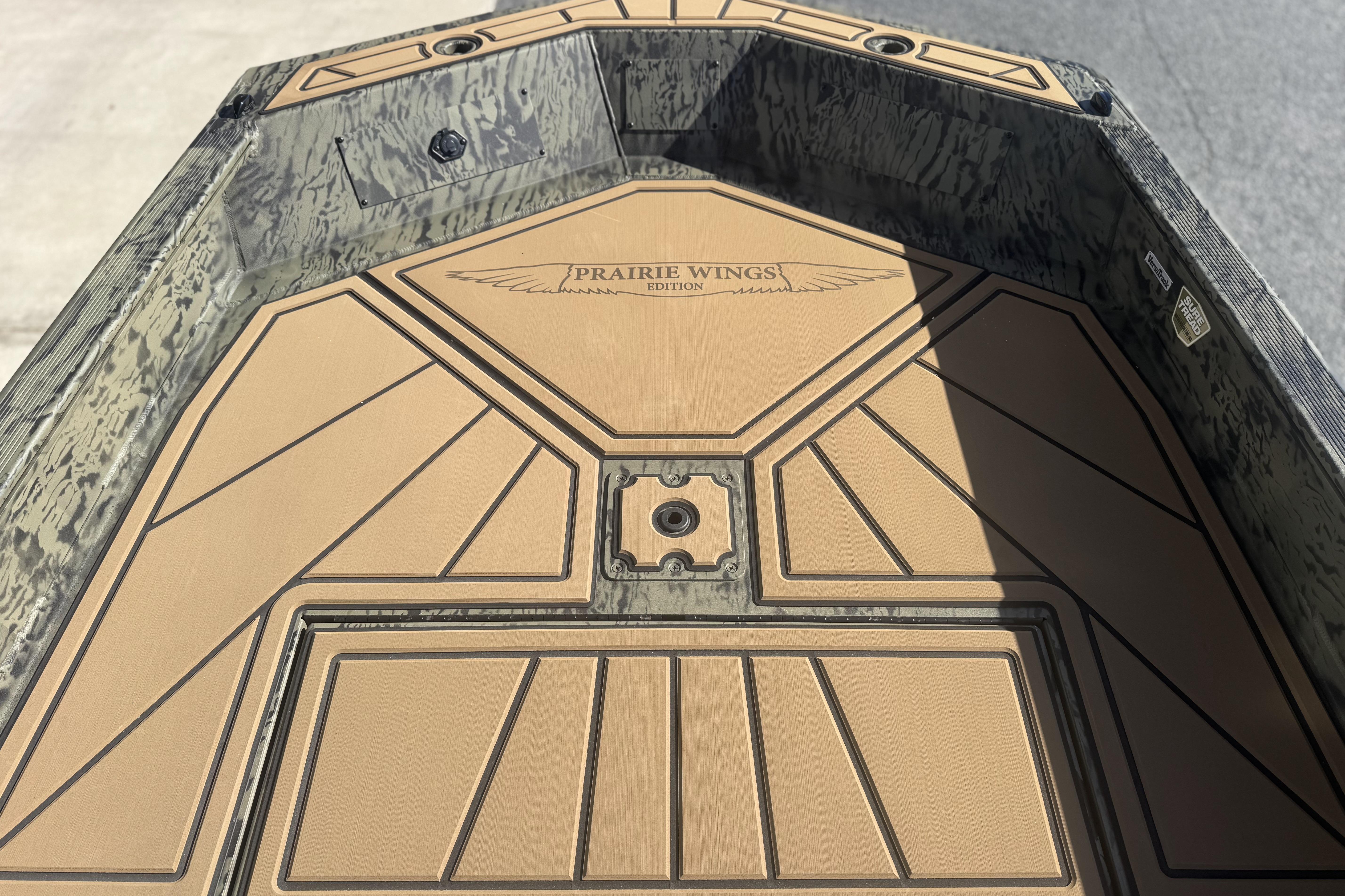 2026 Tracker Grizzly 1650 T Prairie Wings Edition boat interior with custom deck design.